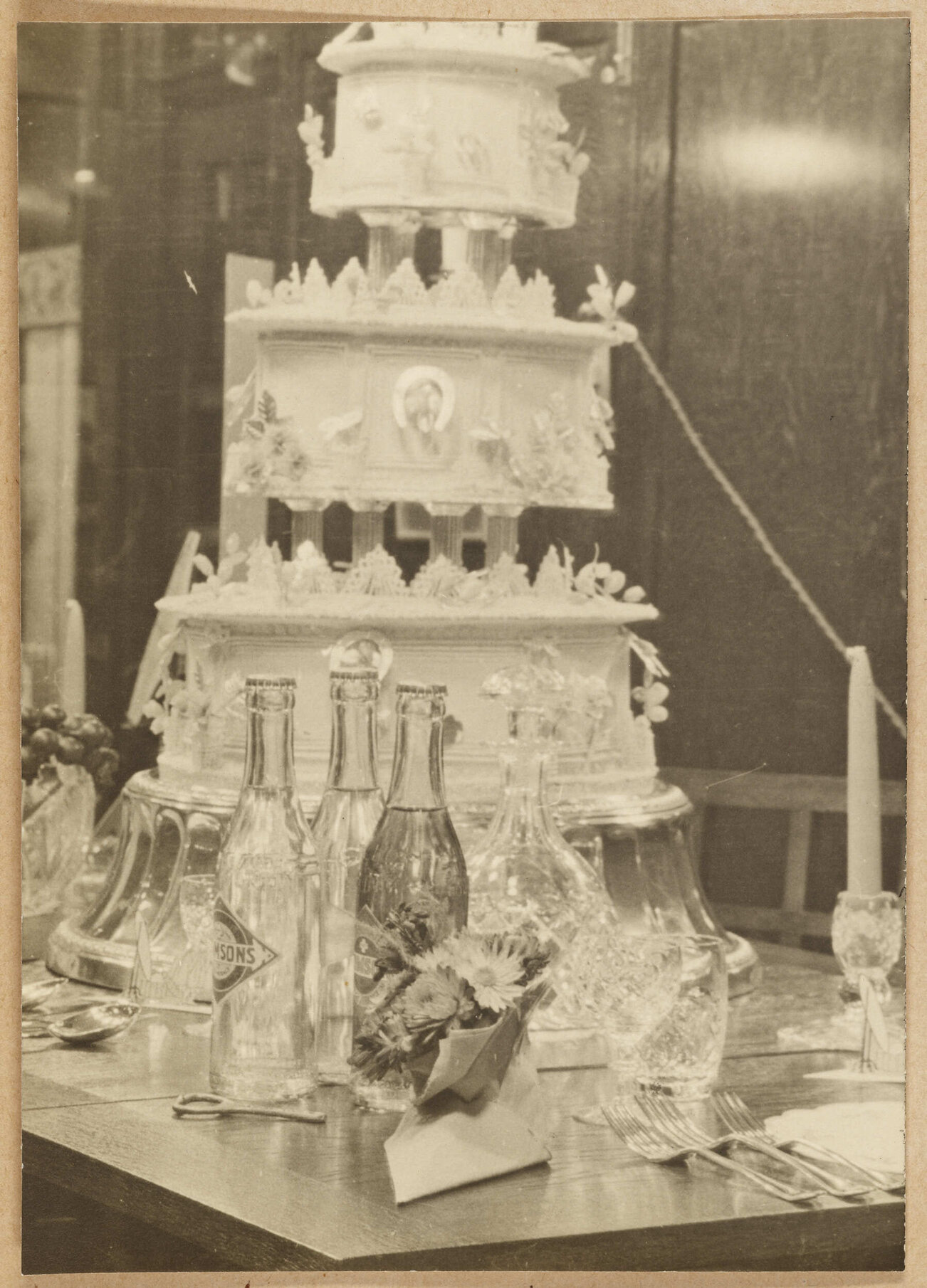 Cake, bottles, and table setting from 'Easter Bride' window display