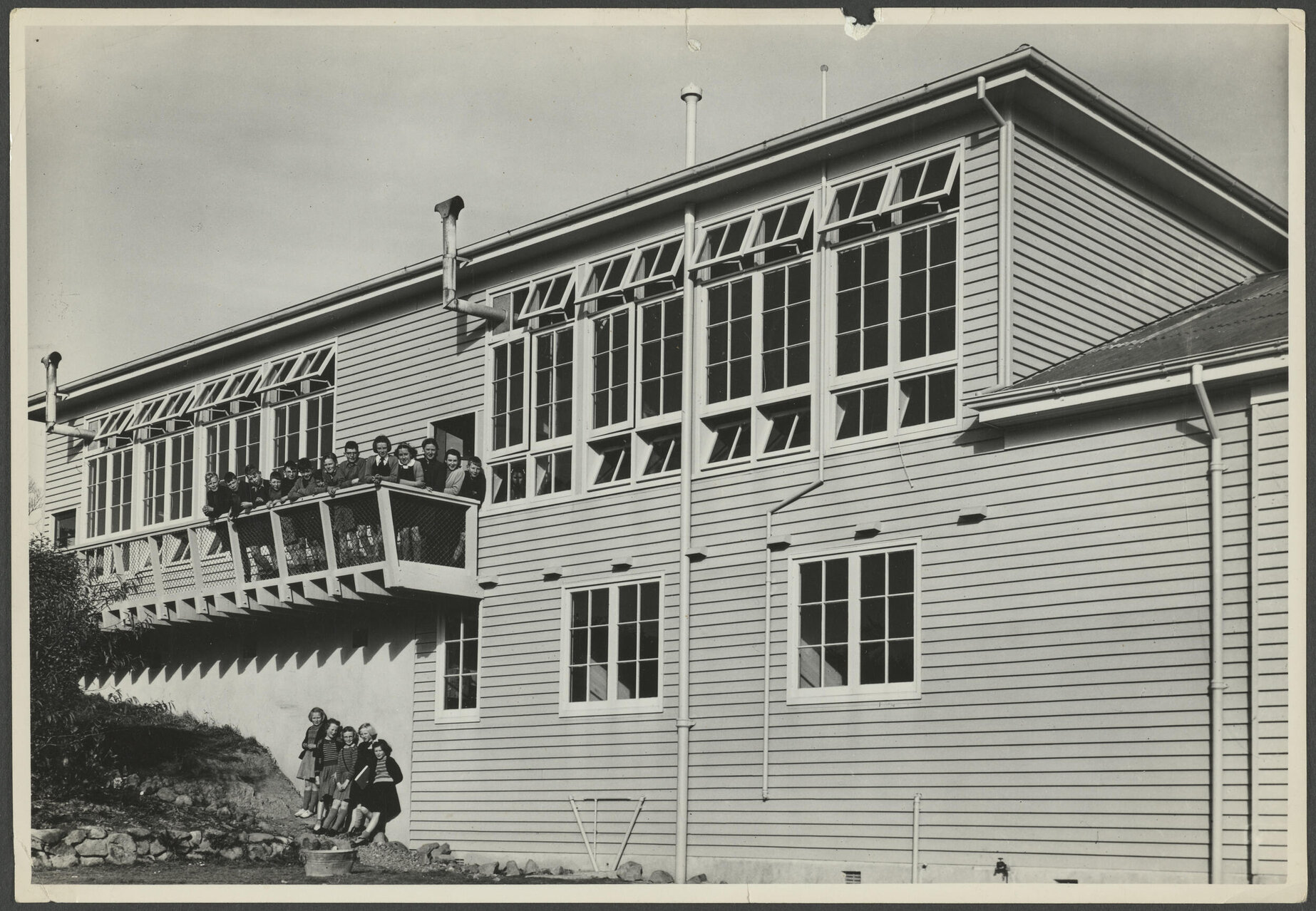 Group of children in front of Wakari School classrooms 