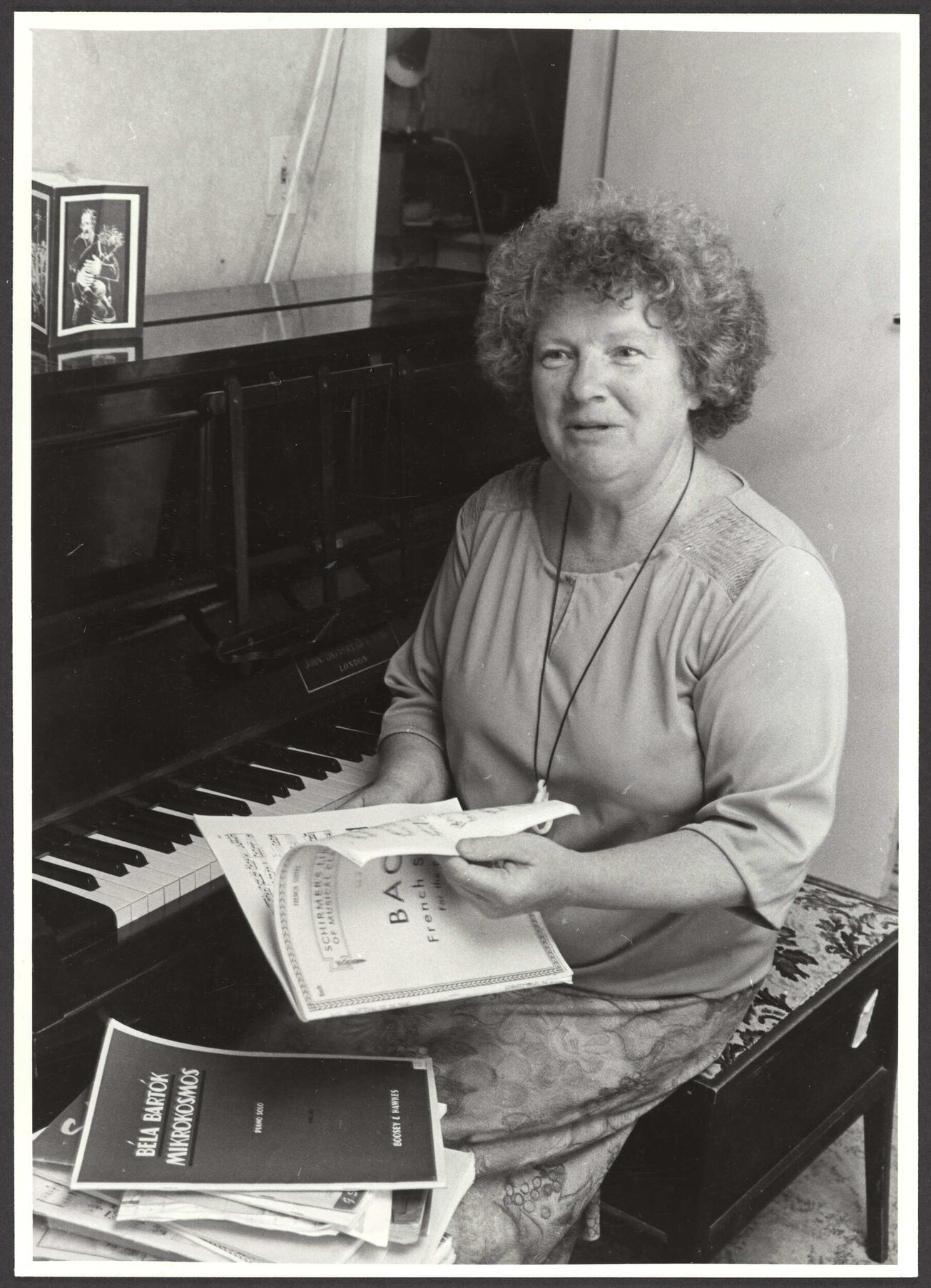 Janet Frame sitting at her piano