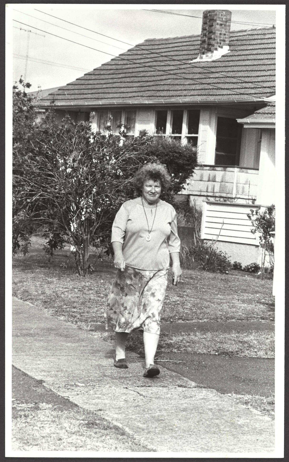 Janet Frame walking on a footpath in Whanganui