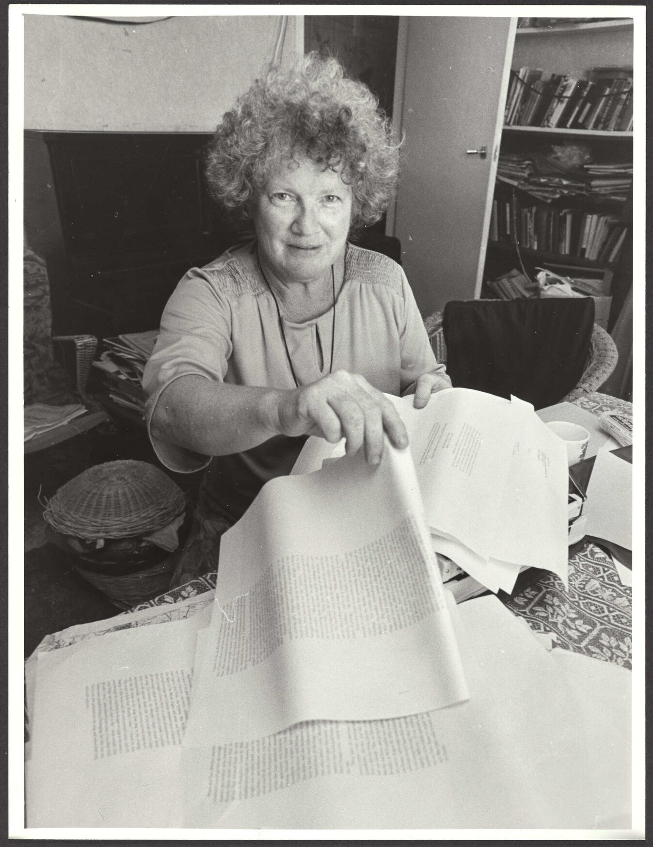 Janet Frame holding proofs