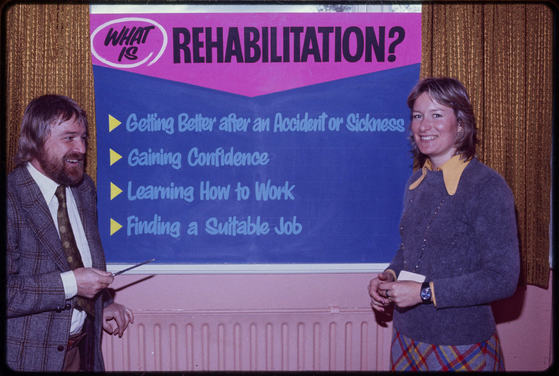 Rehabilitation League staff with sign titled 'What is Rehabilitation?'