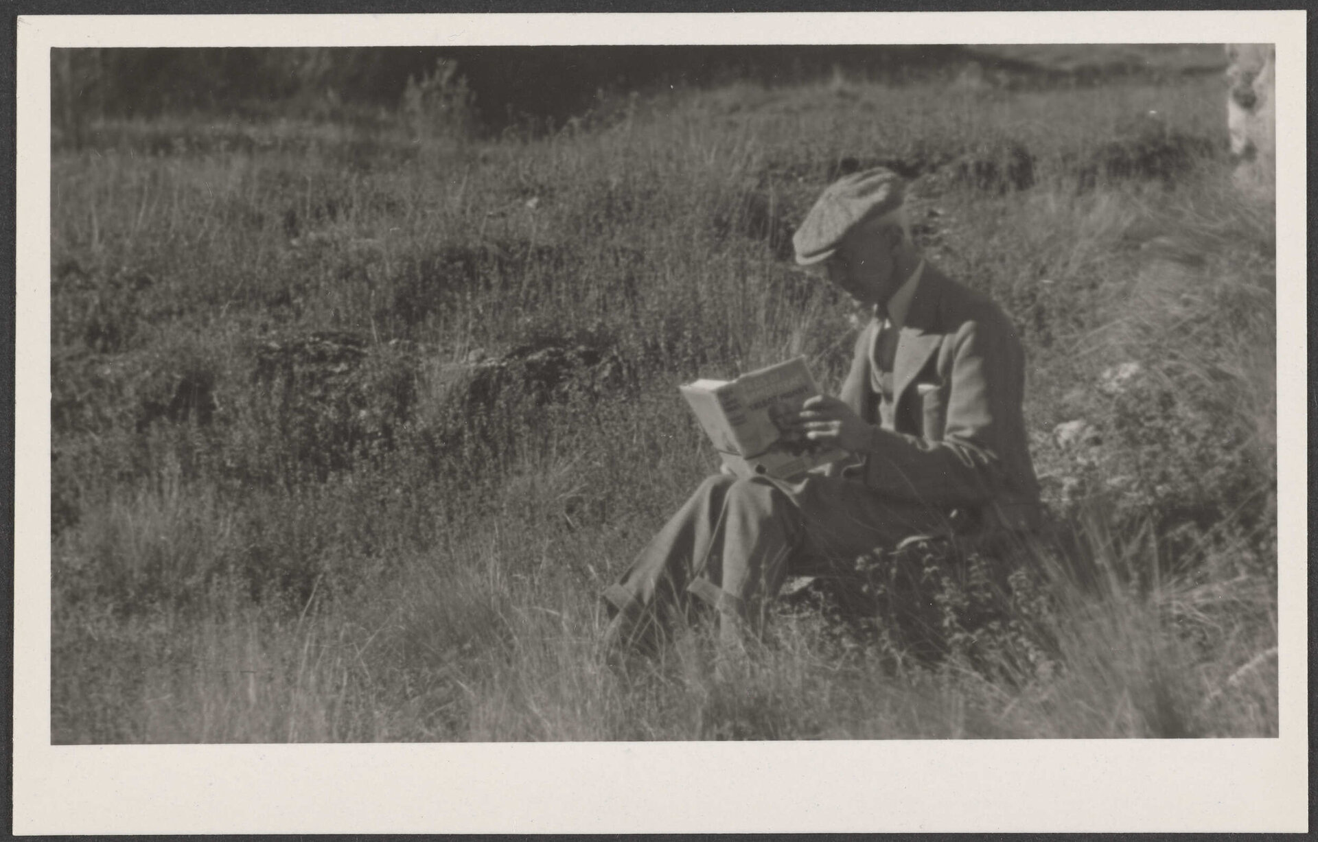  [Henry Brasch] reading outdoors