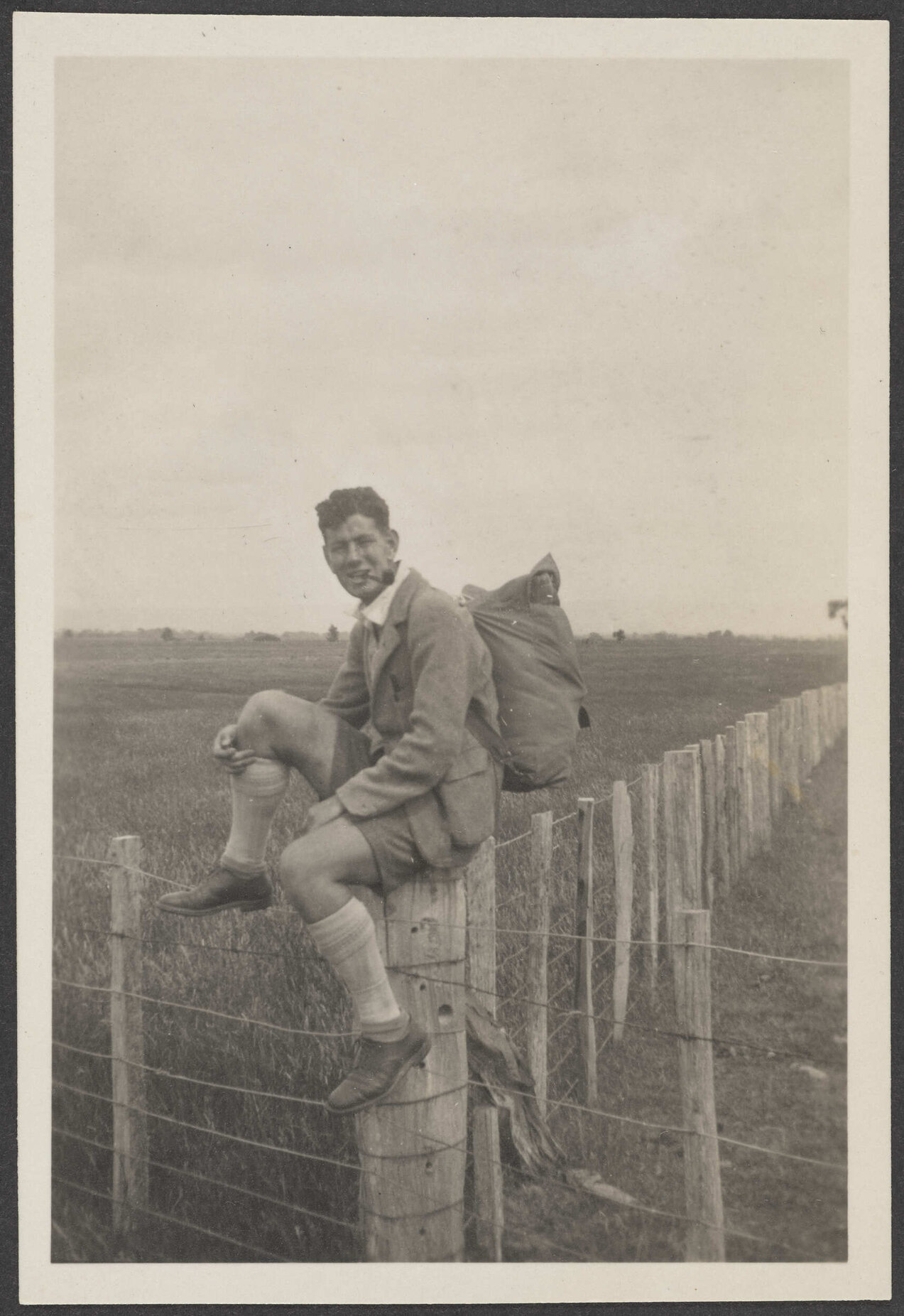 [James Bertram] sitting on a fence