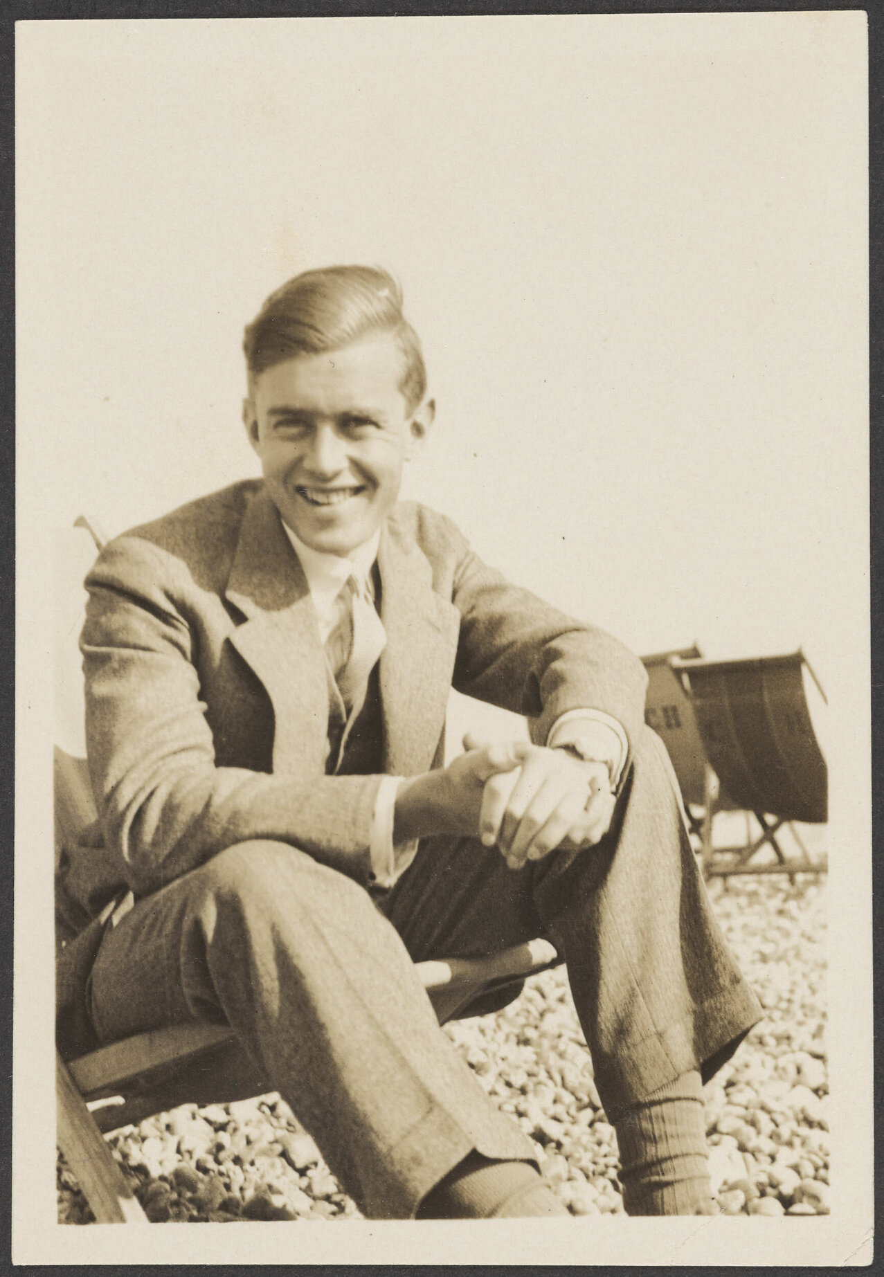 Unidentified man on a pebble beach in Hove