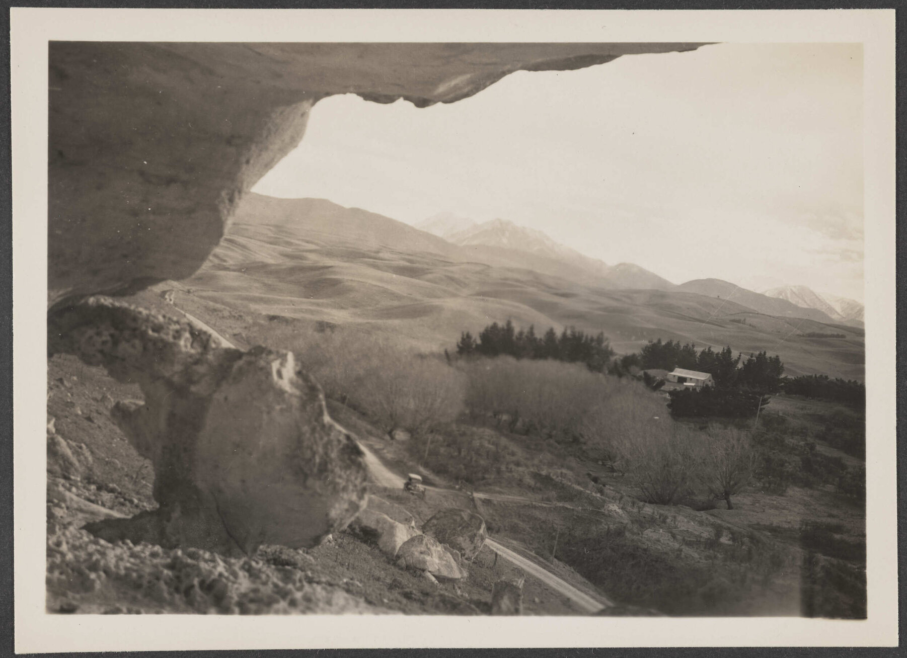 View from rocky hillside over rural landscape