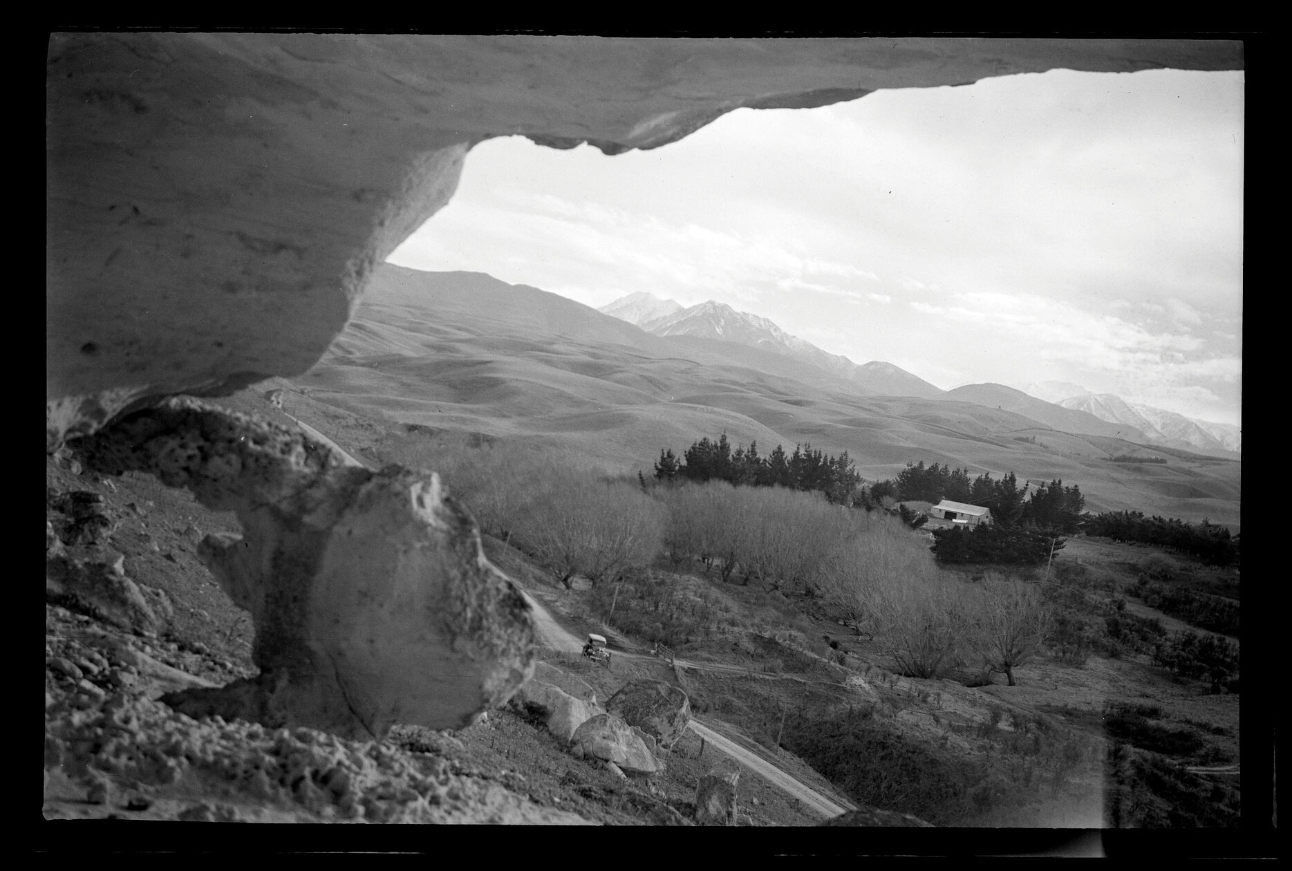 A view from rocky hillside over rural landscape