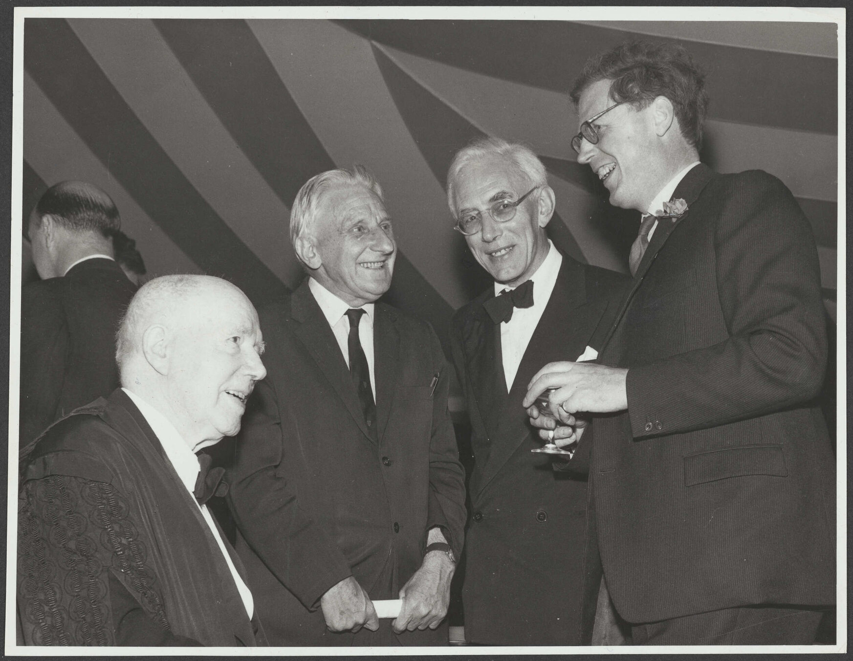 Trevor, [?], Jack Edmund Blunden and Sir David Ross at a party