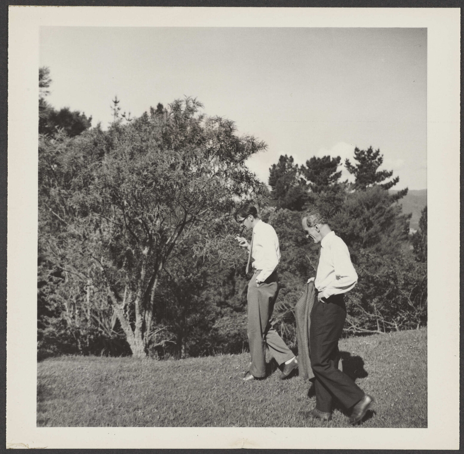 Charles Brasch, W.H. Oliver walking