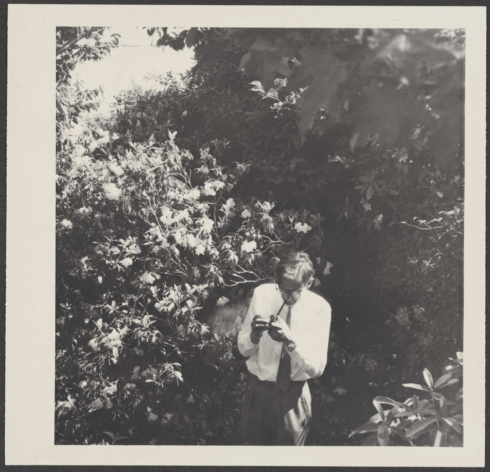 W.H. Oliver lighting a pipe