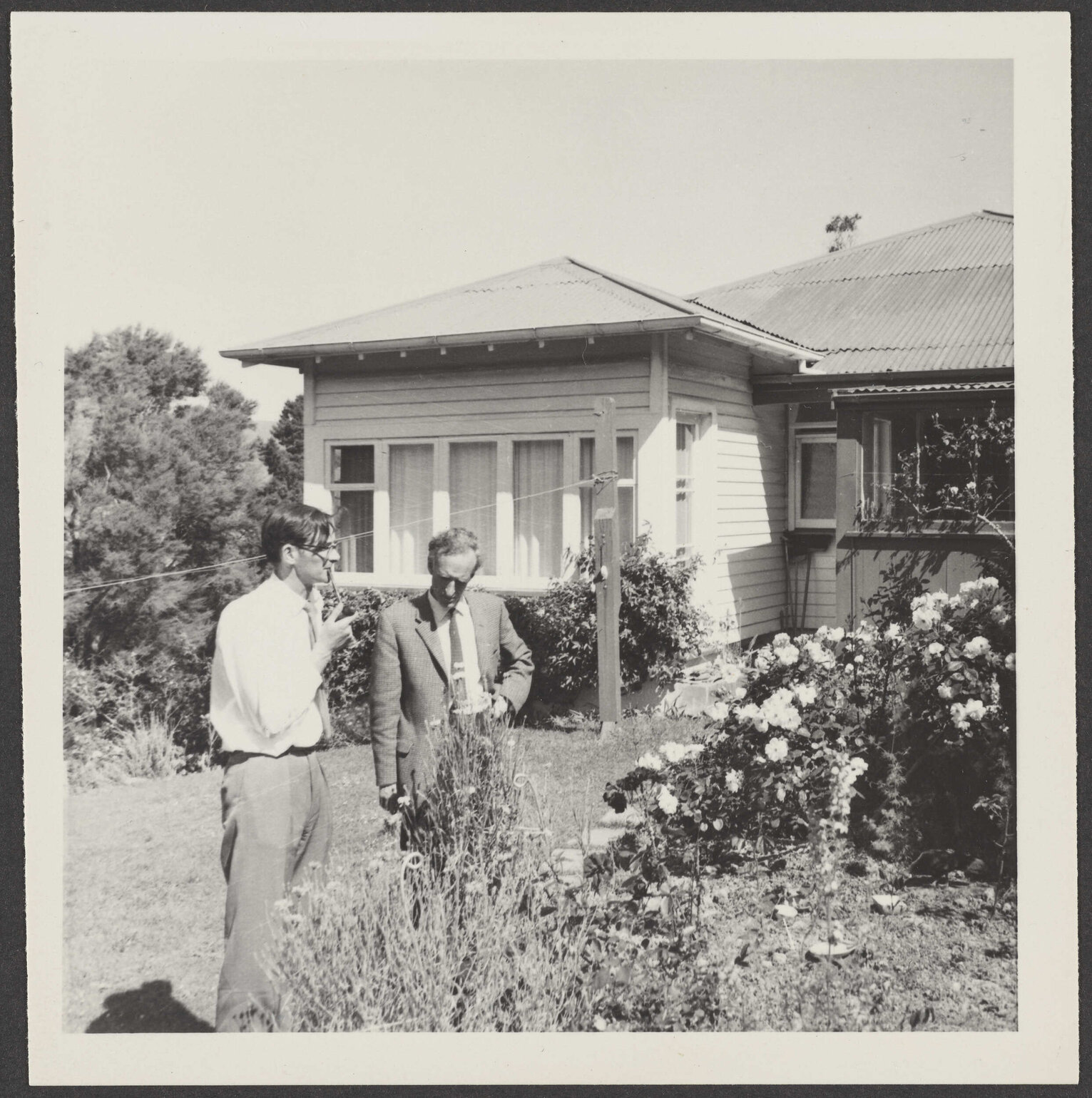 Charles Brasch and W.H. Oliver in the garden