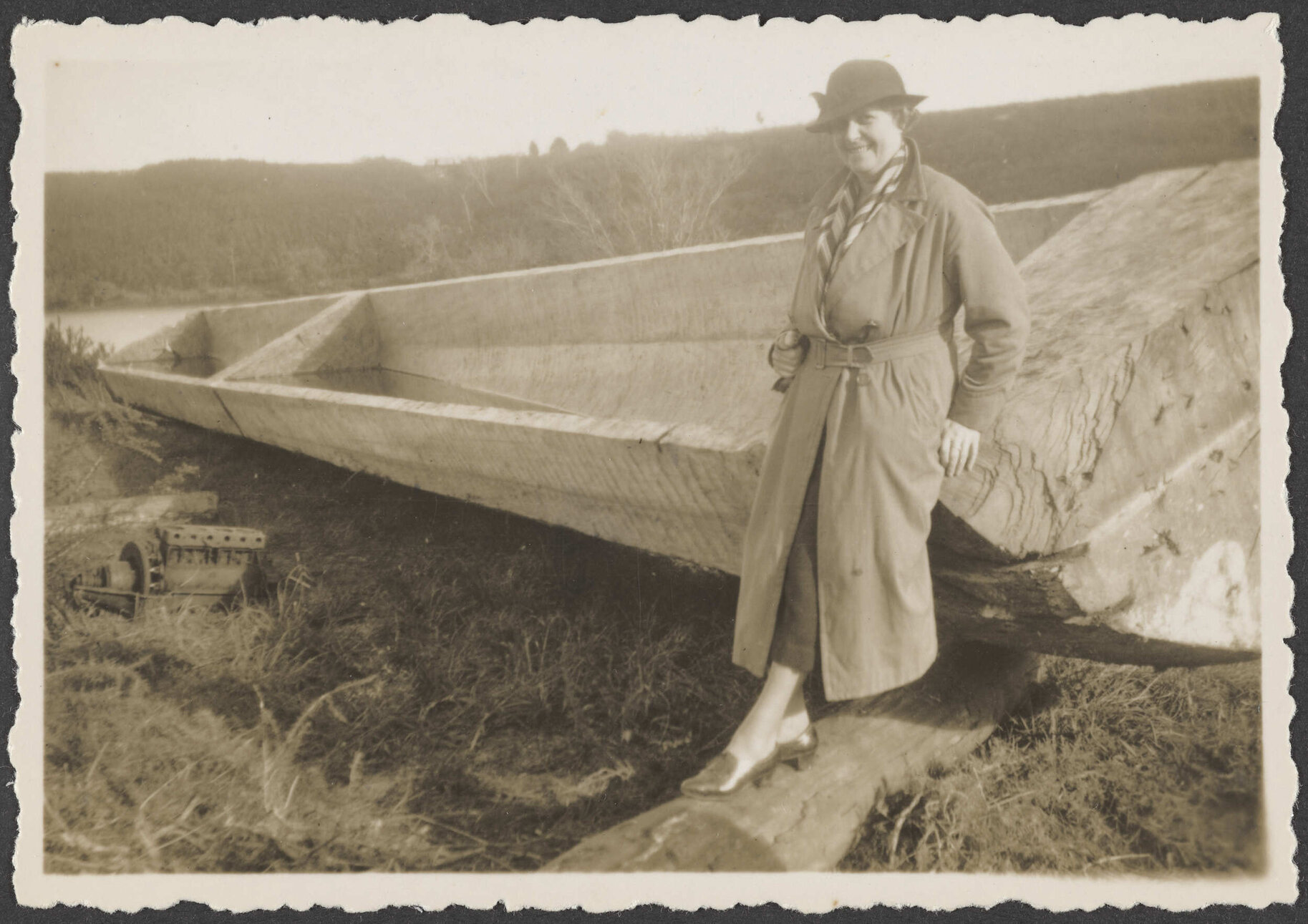 Woman leaning on a wooden boat