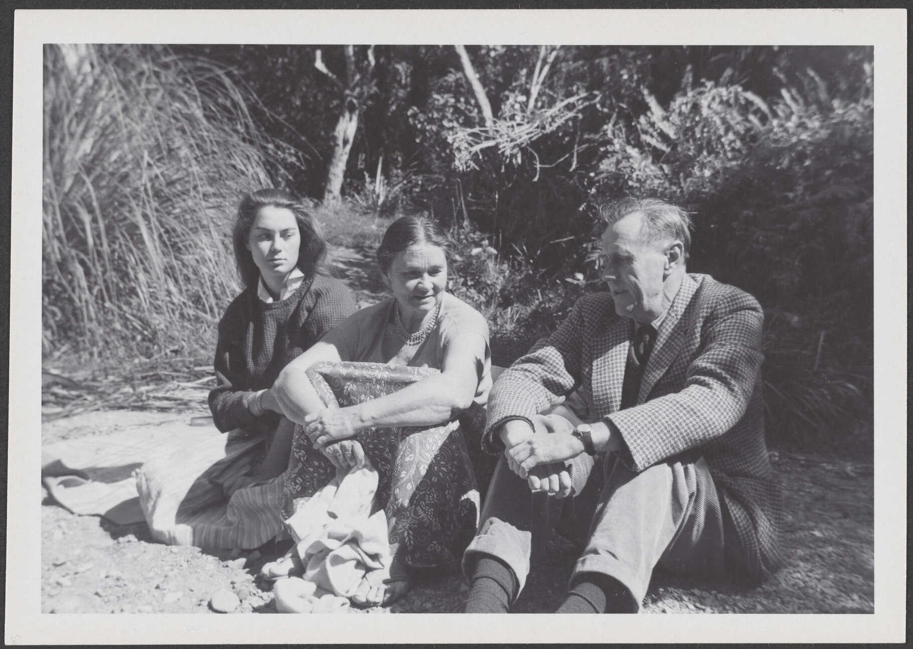 [? Garland], Peggy Garland, and Patrick White, sitting outside