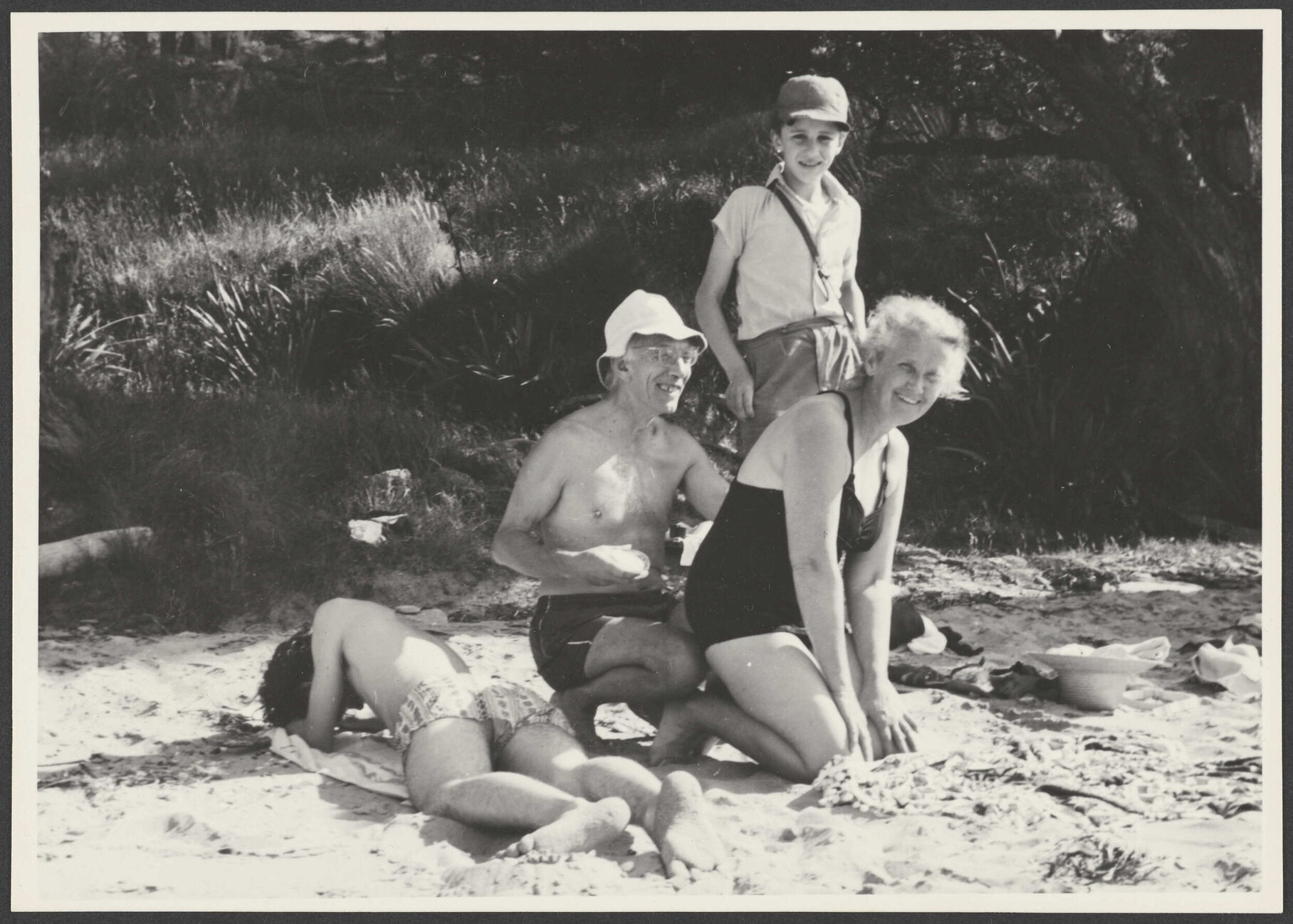 Jack and Gwyneth Bennett with two boys on a beach