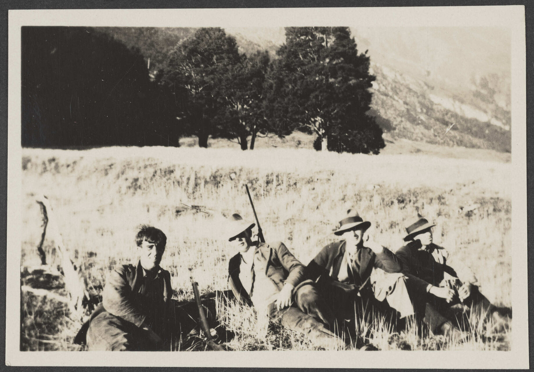 'Four men in mountains'