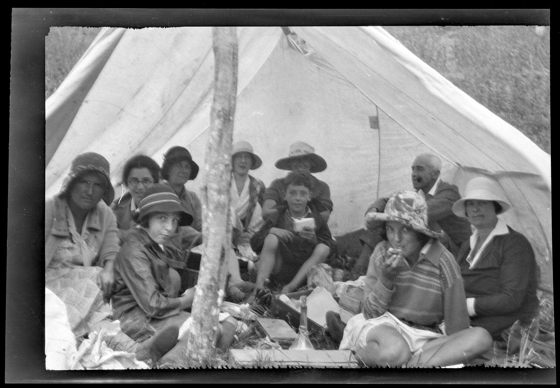 Picnic group under canvas