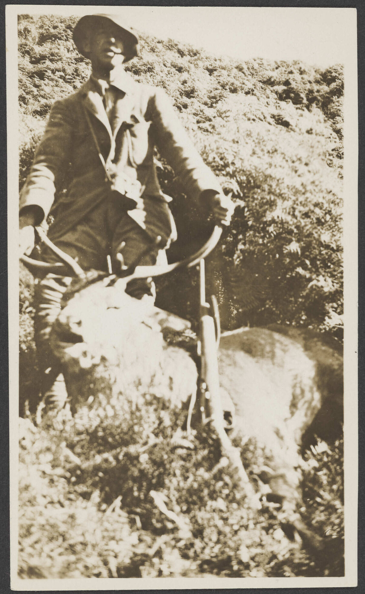 Man with a dead stag