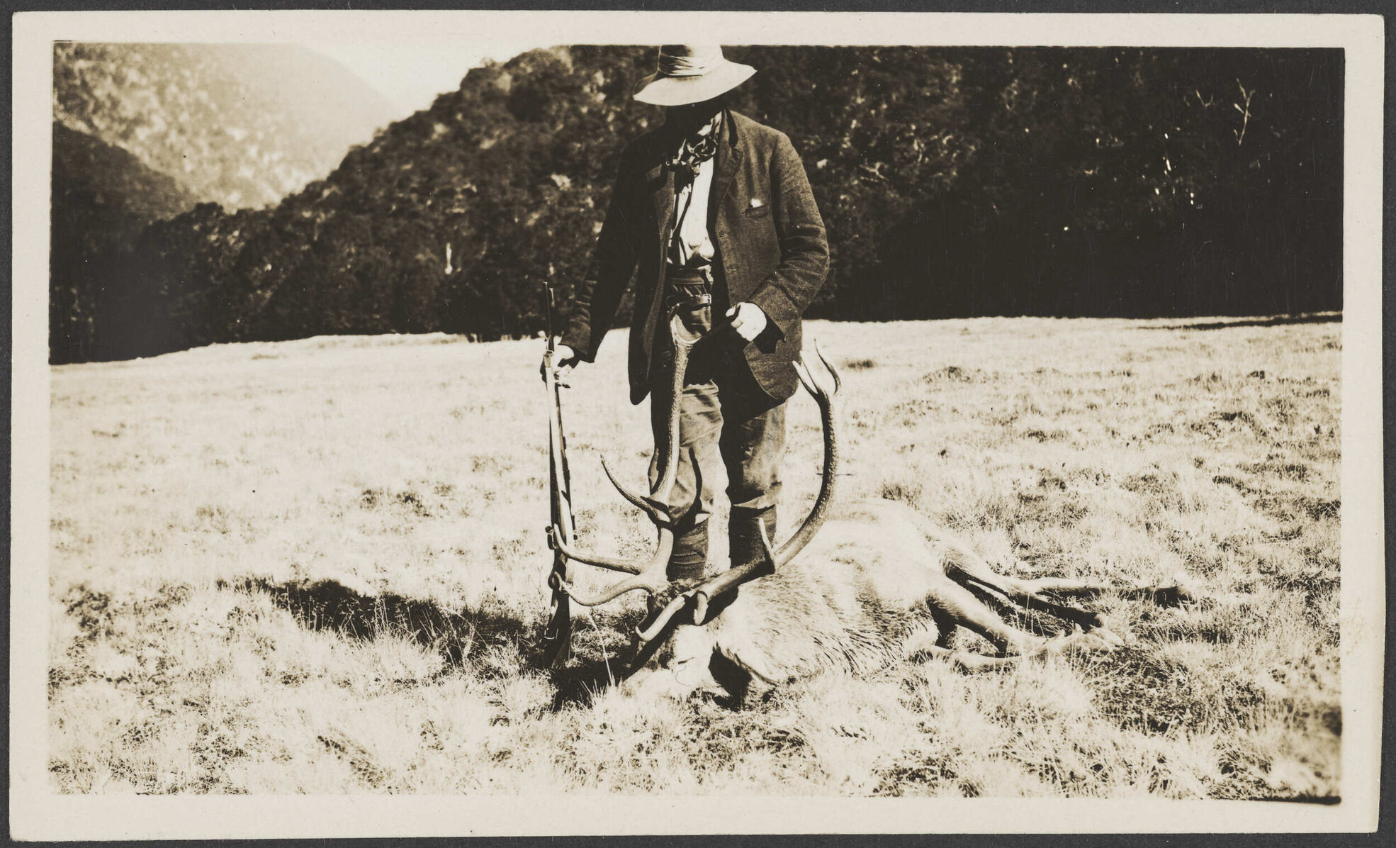 Man with a dead stag