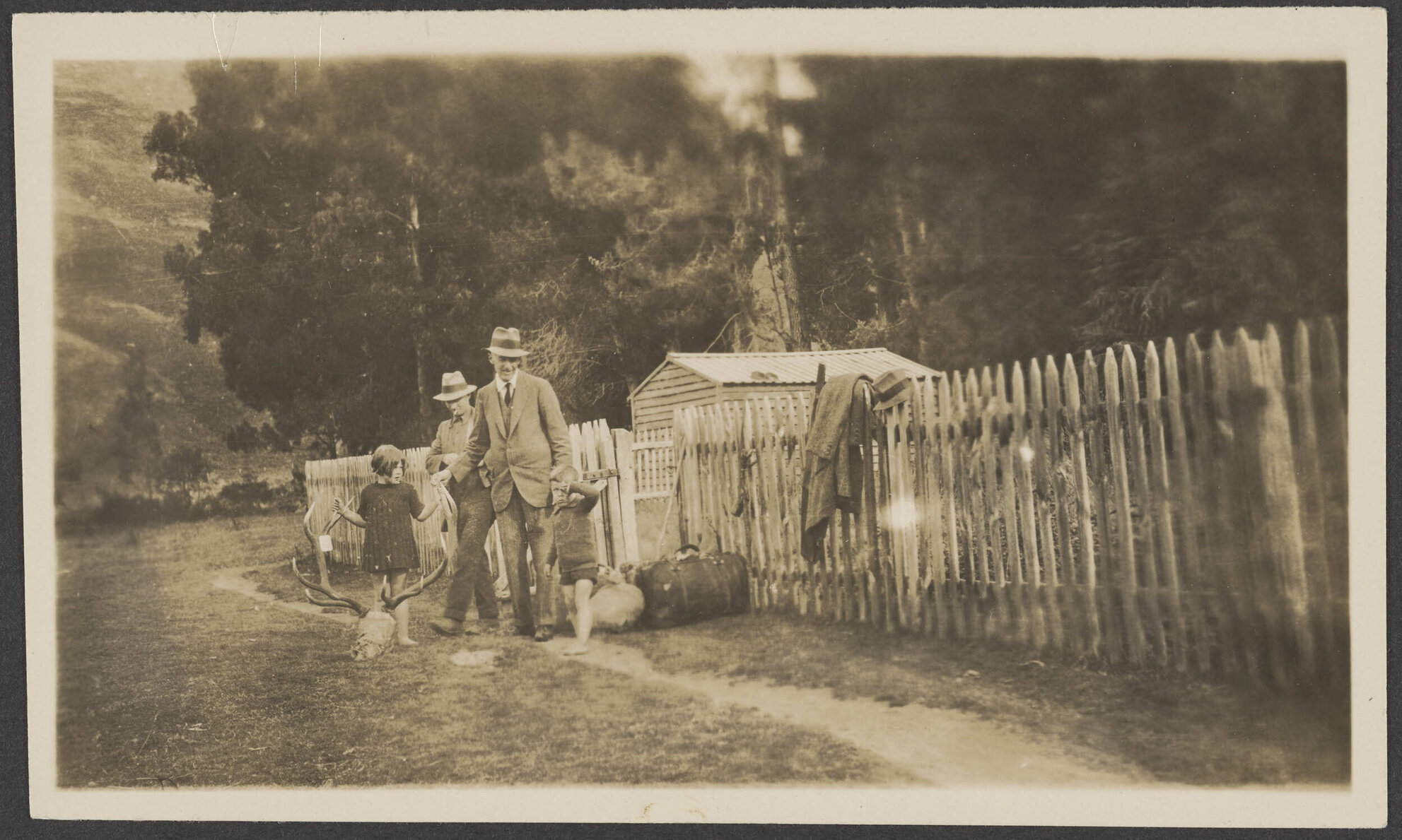 Men and children with stag trophy