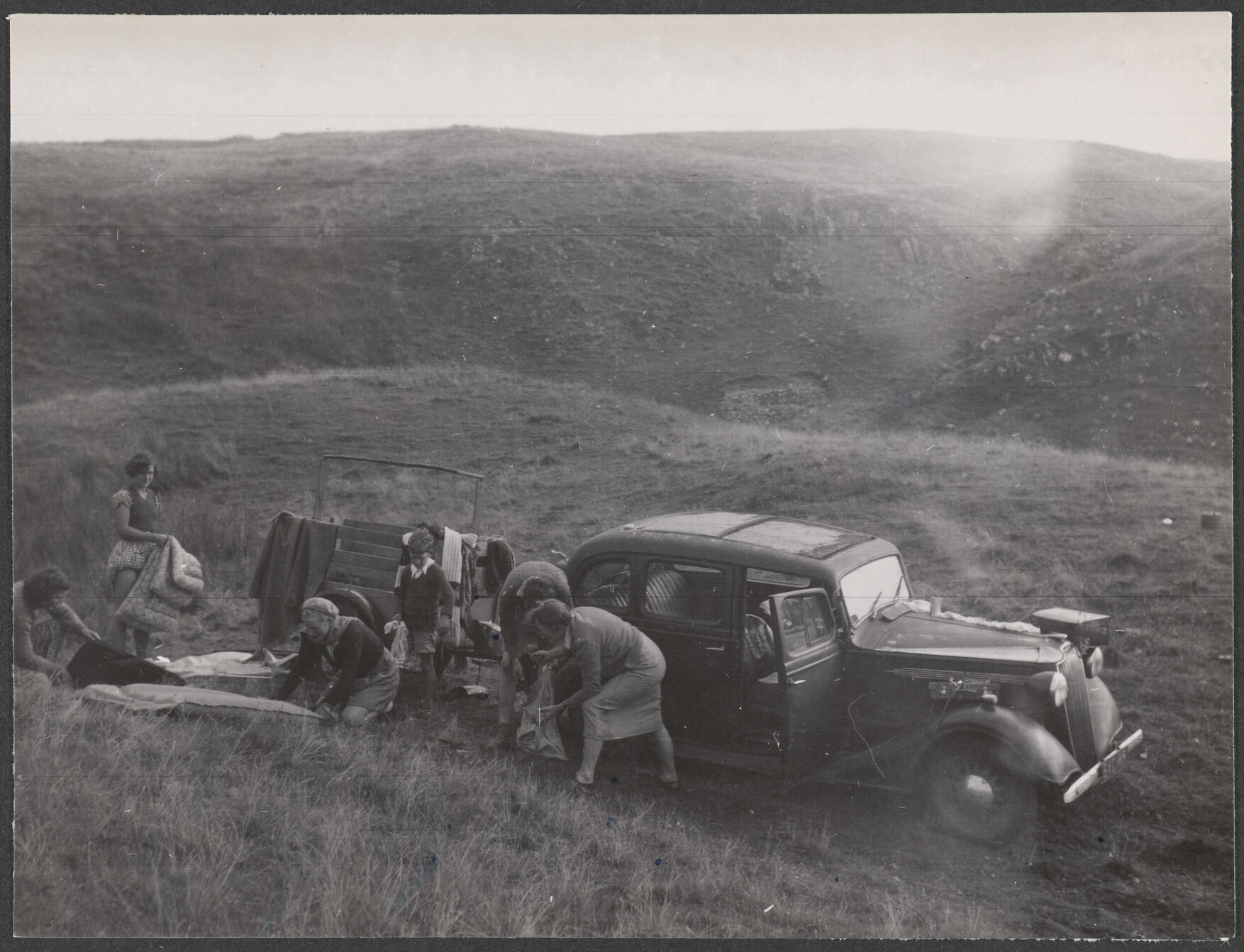 Bettina Hamilton and five of her children packing up their car