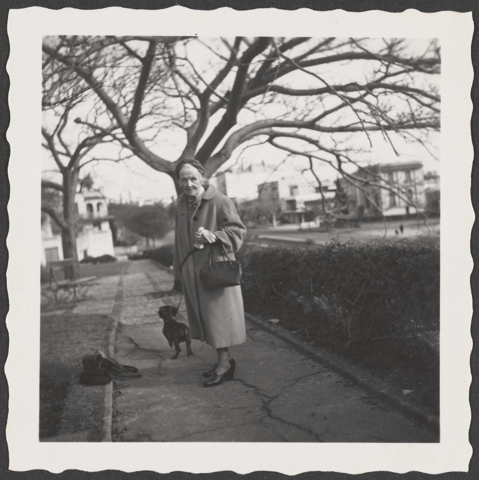 Ethel Englefield on the street with a dog