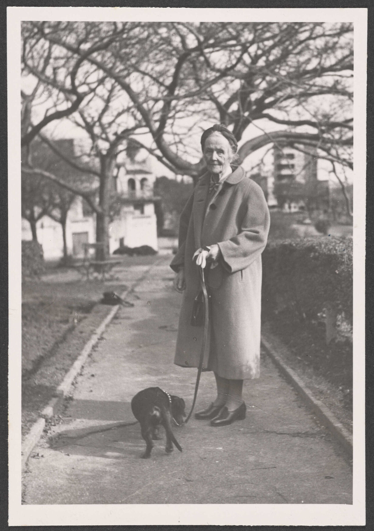 Ethel Englefield on the street with a dog