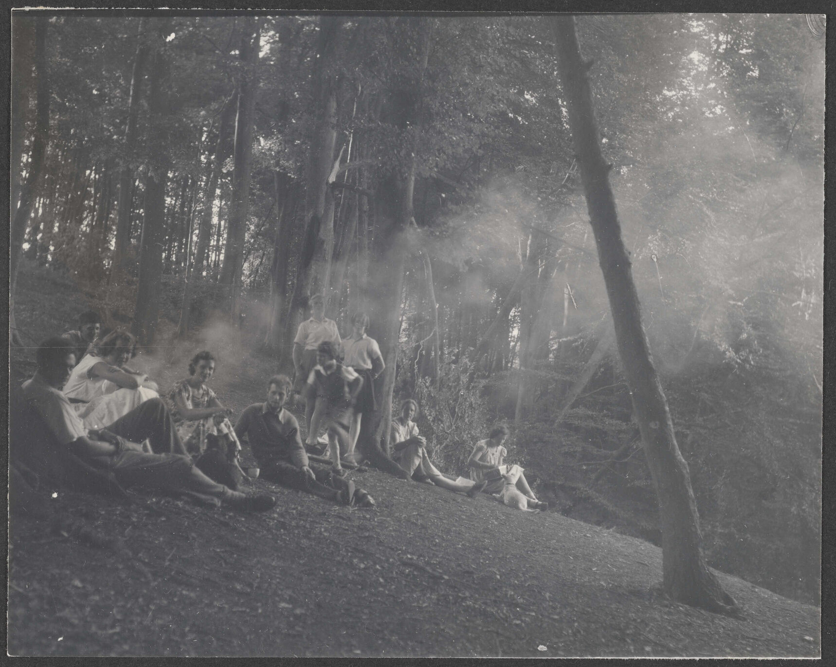 Bettina Hamilton and five of her children with another group in a forest