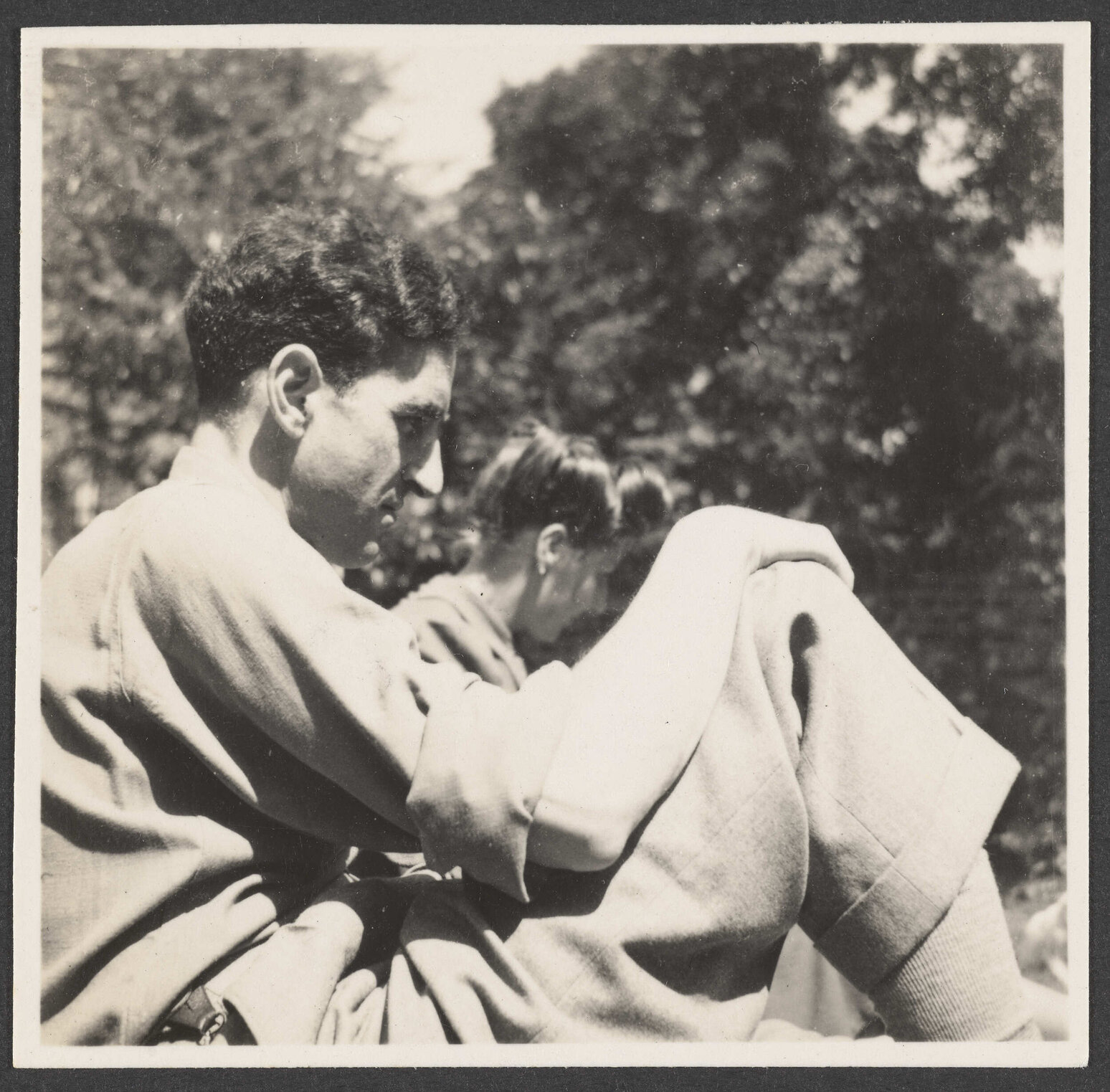 Charles Brasch and a woman in the garden
