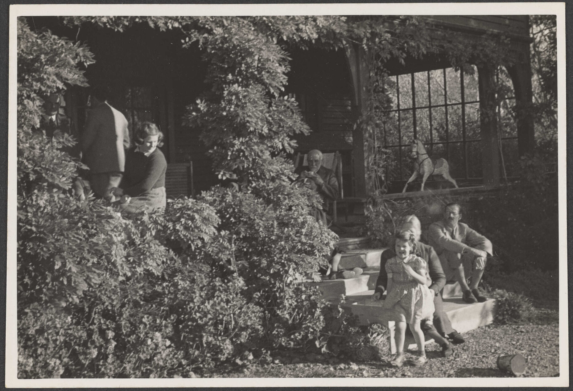 Group of people on porch and steps