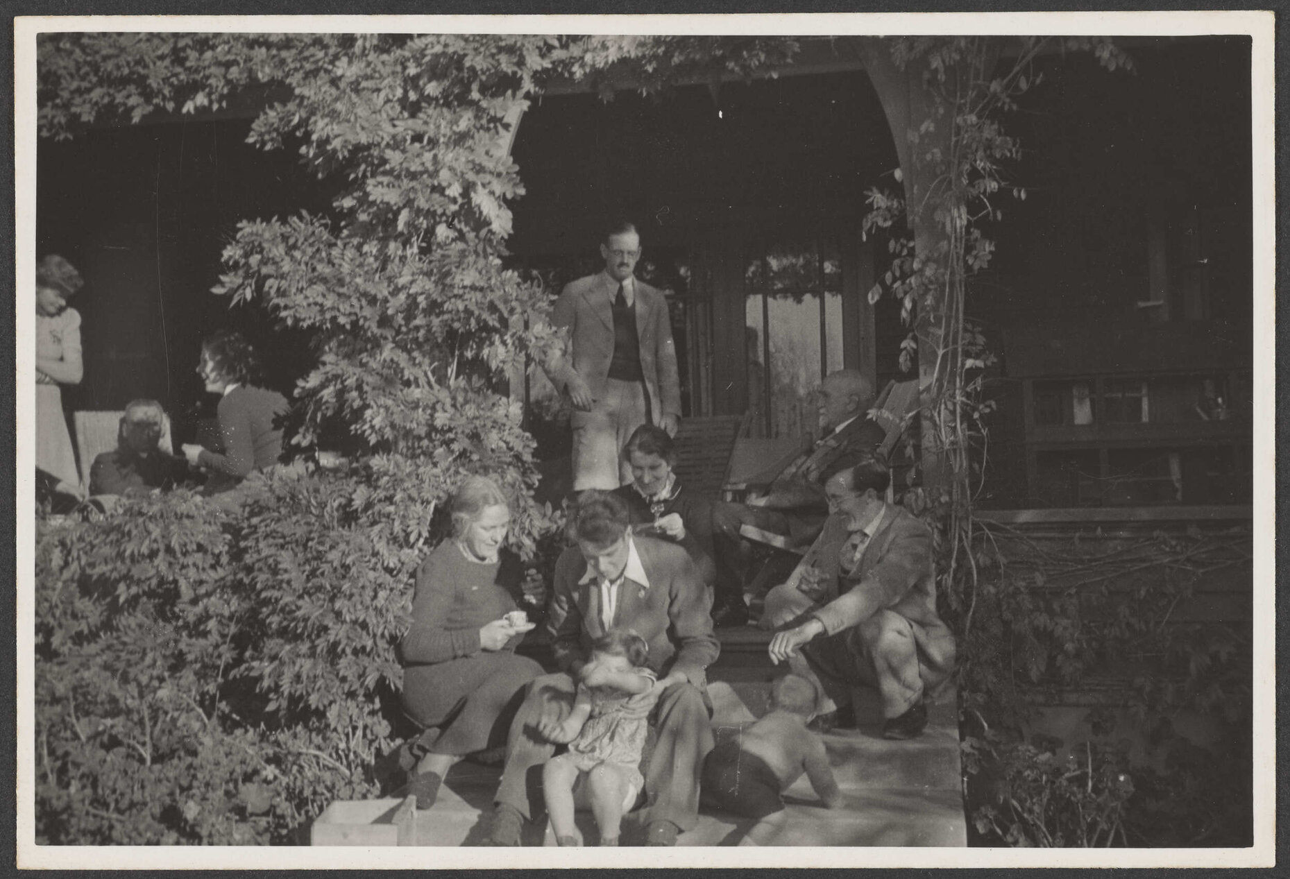 Group of people on porch and steps