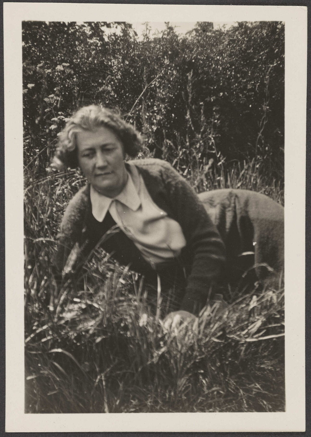 Woman lying in grass [Mrs Lister-Kaye]