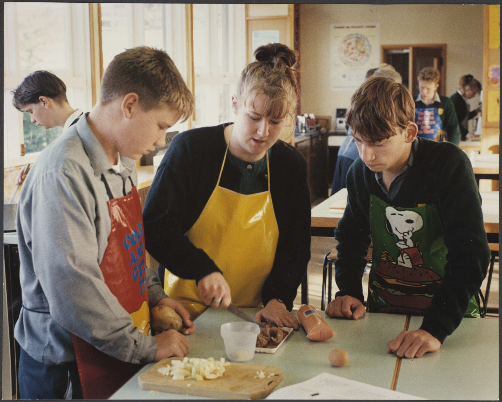 Teacher and pupils in food technology classroom at Bayfield High School