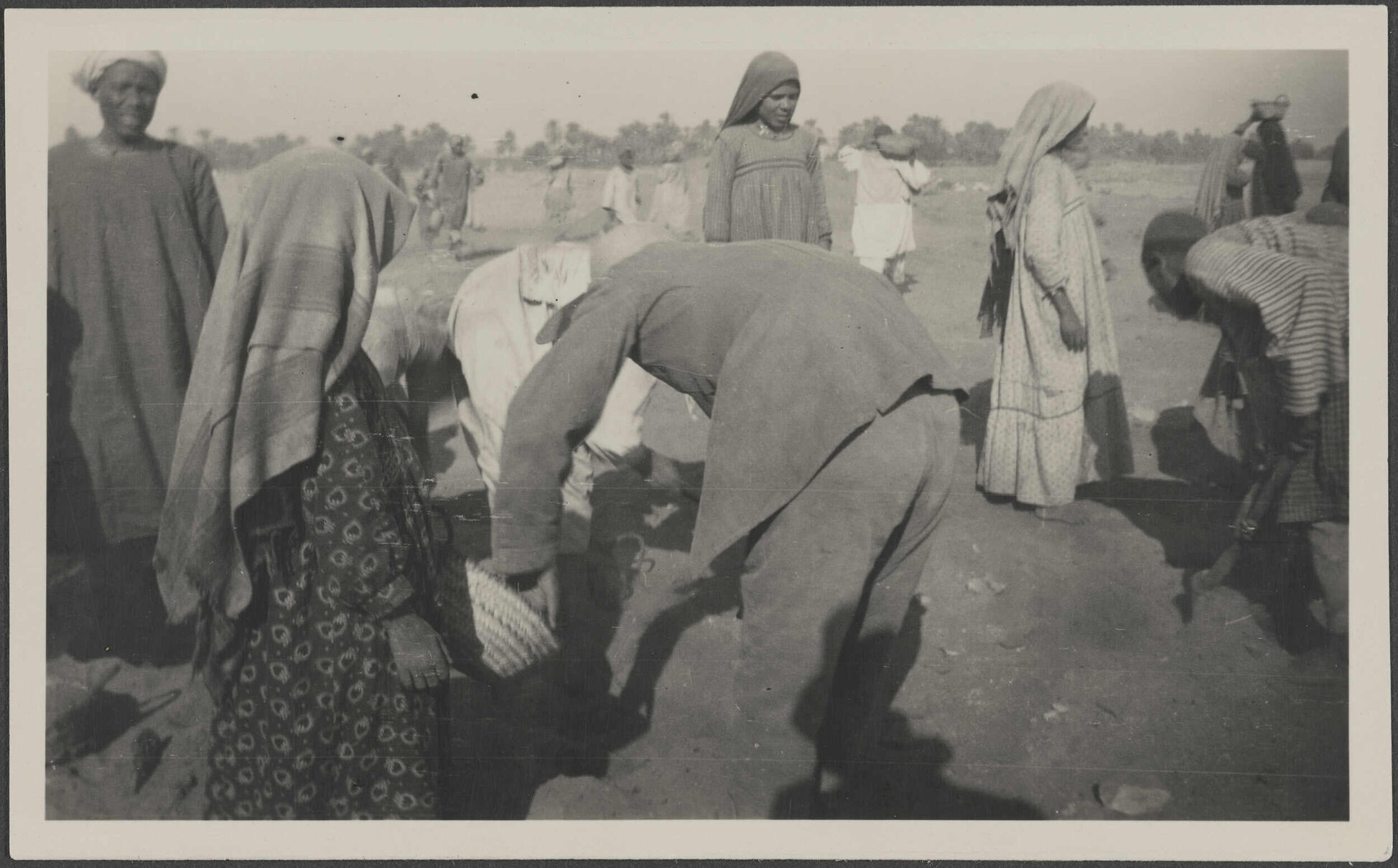 'Hassan Khalil (left) Tubai's back. 1933-4'
