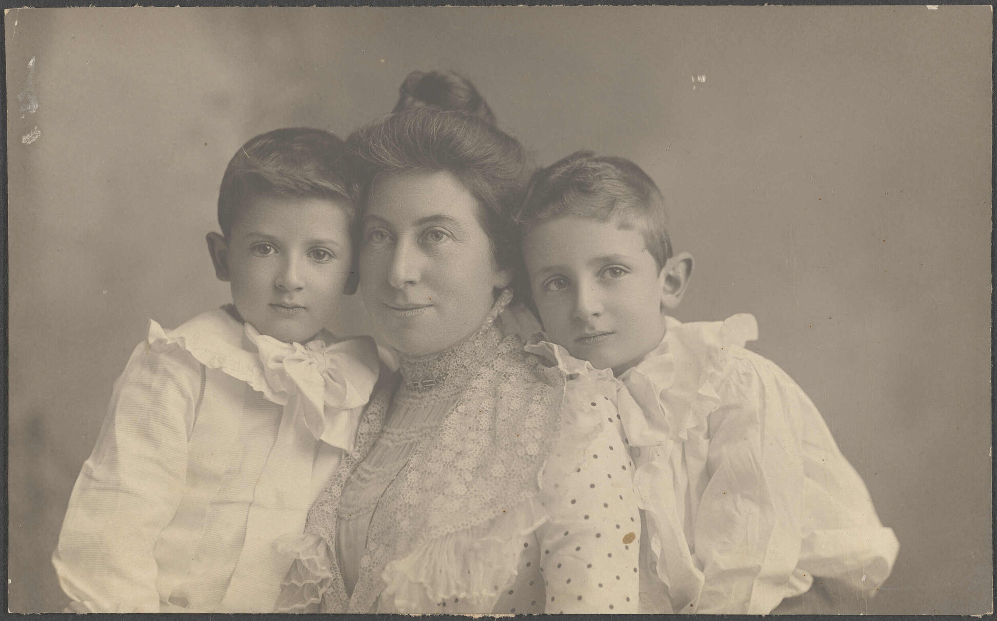 Unidentified woman and two boys