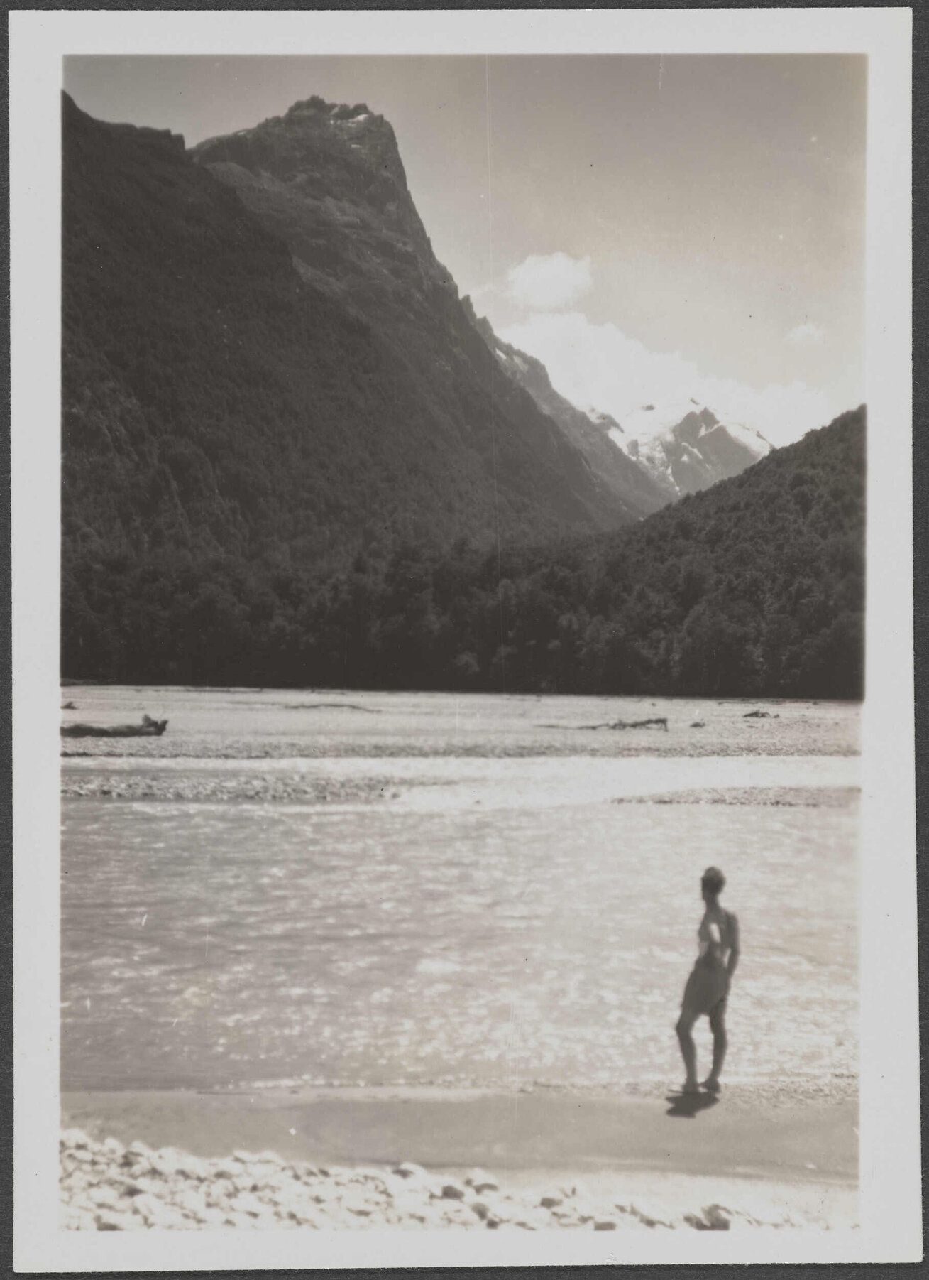 Unidentified man [Charles Brasch?] by a river