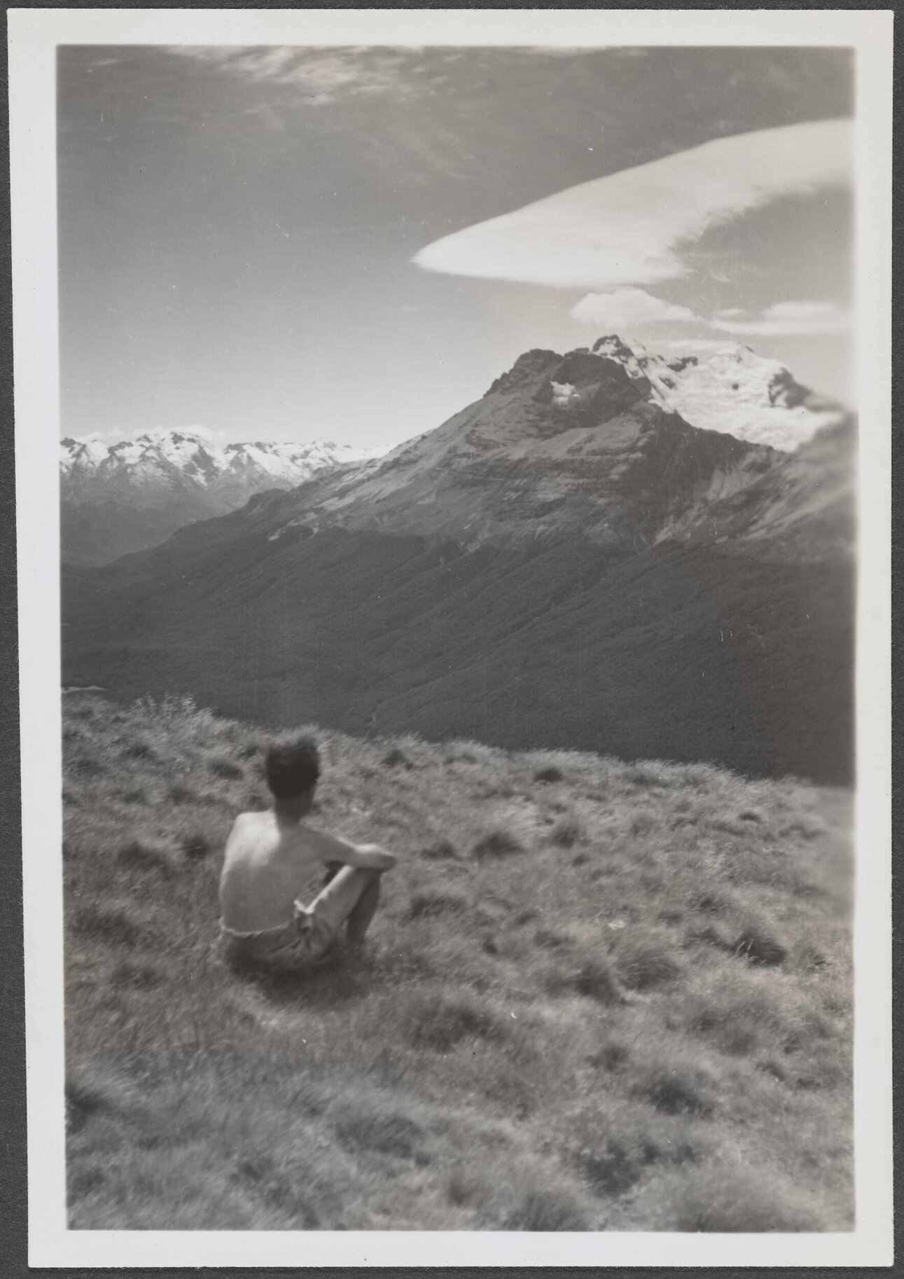 Unidentified man [Charles Brasch?] overlooking a mountain range