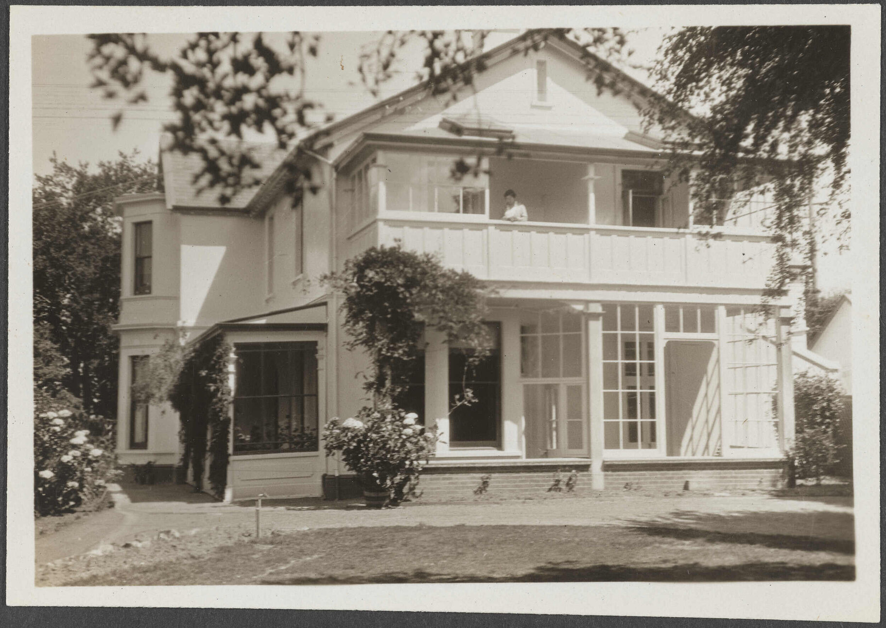 Bankton with unidentified person on balcony