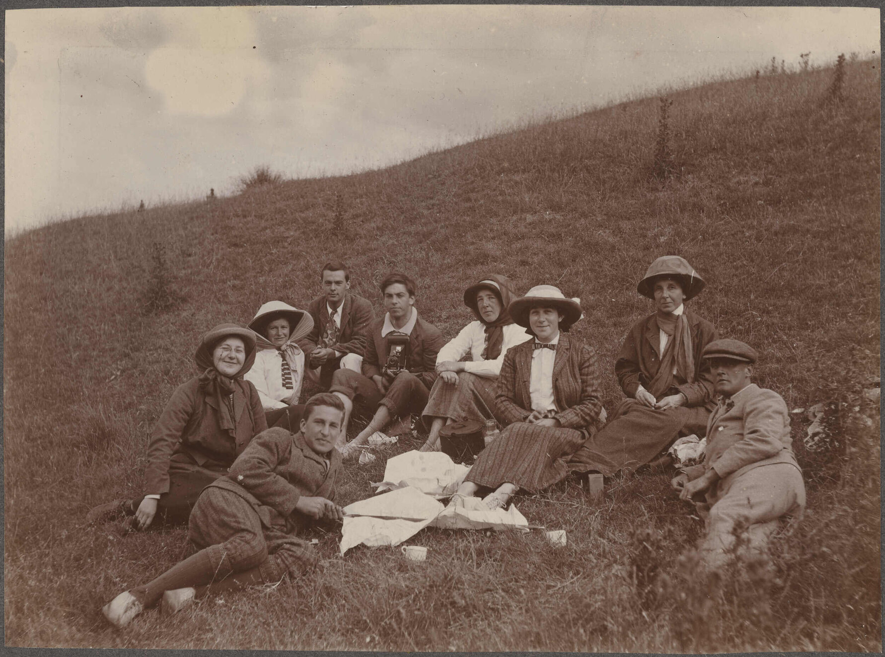 Picnic group sitting on hillside
