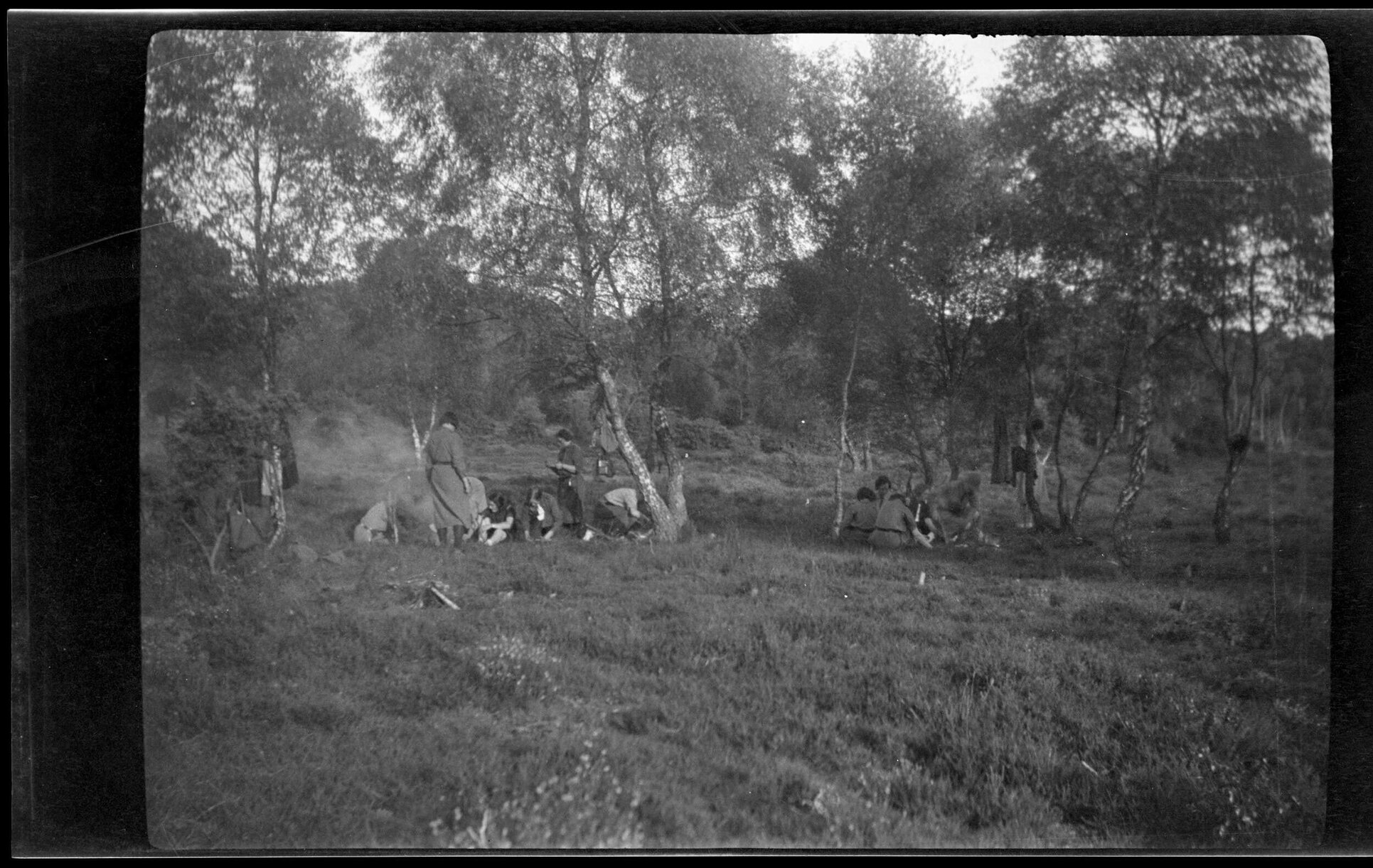 Groups of young women under trees [Girl Guides]