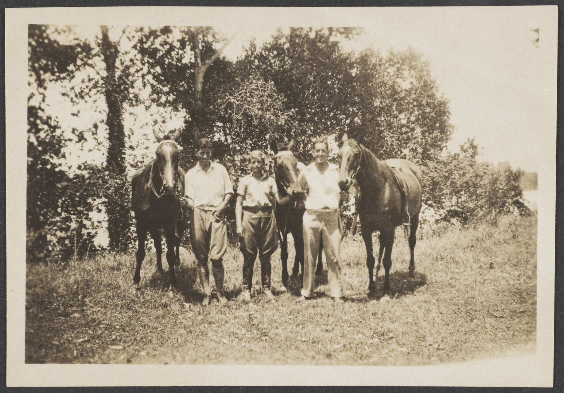 Three men with horses