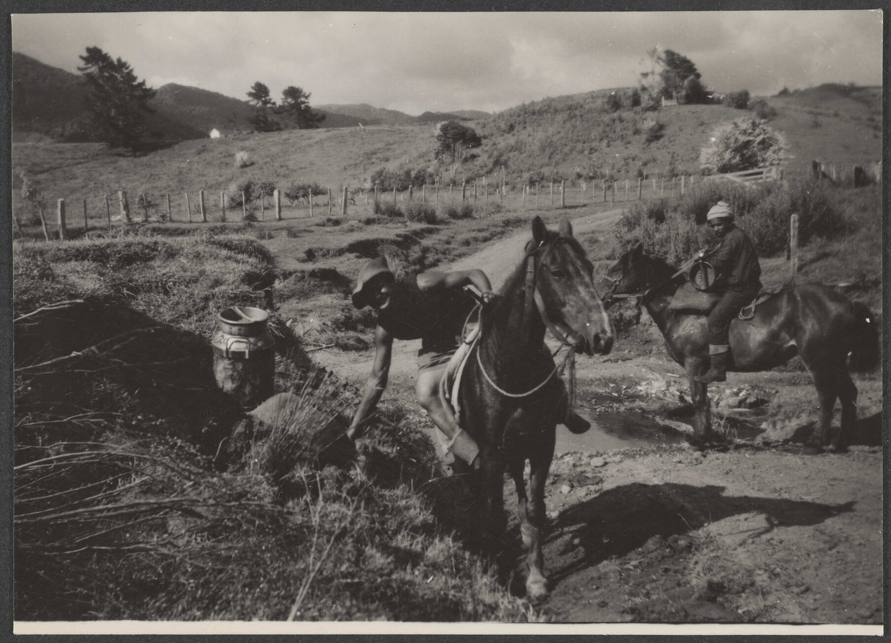 Workmen on horseback
