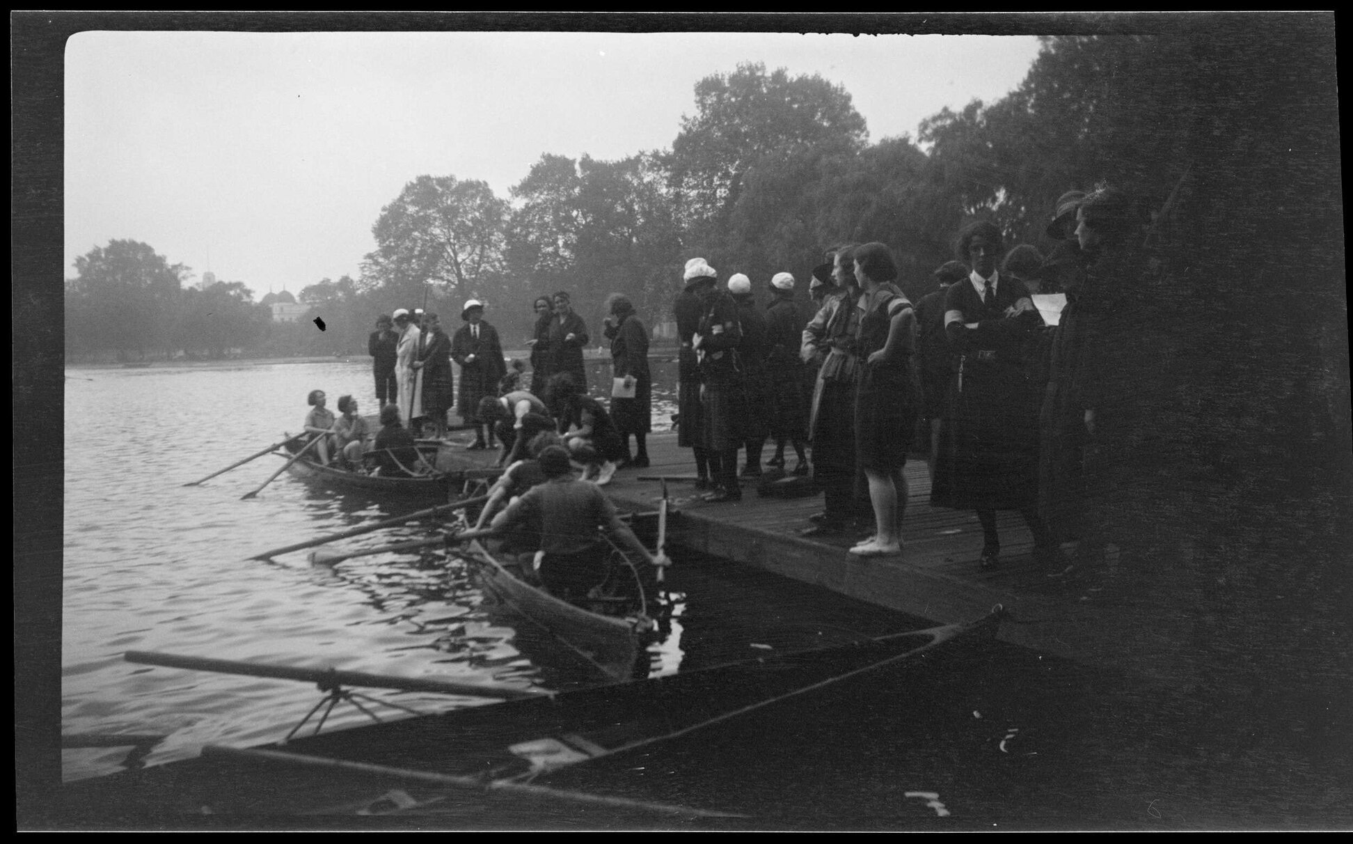 Women in boats and on jetty [Girl Guides]