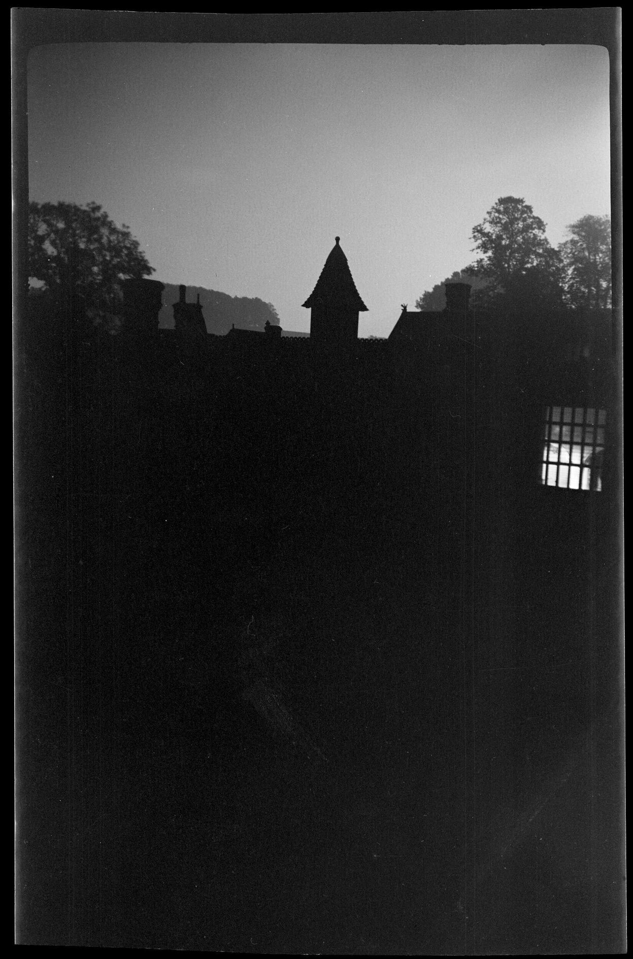Buildings silhouetted against night sky