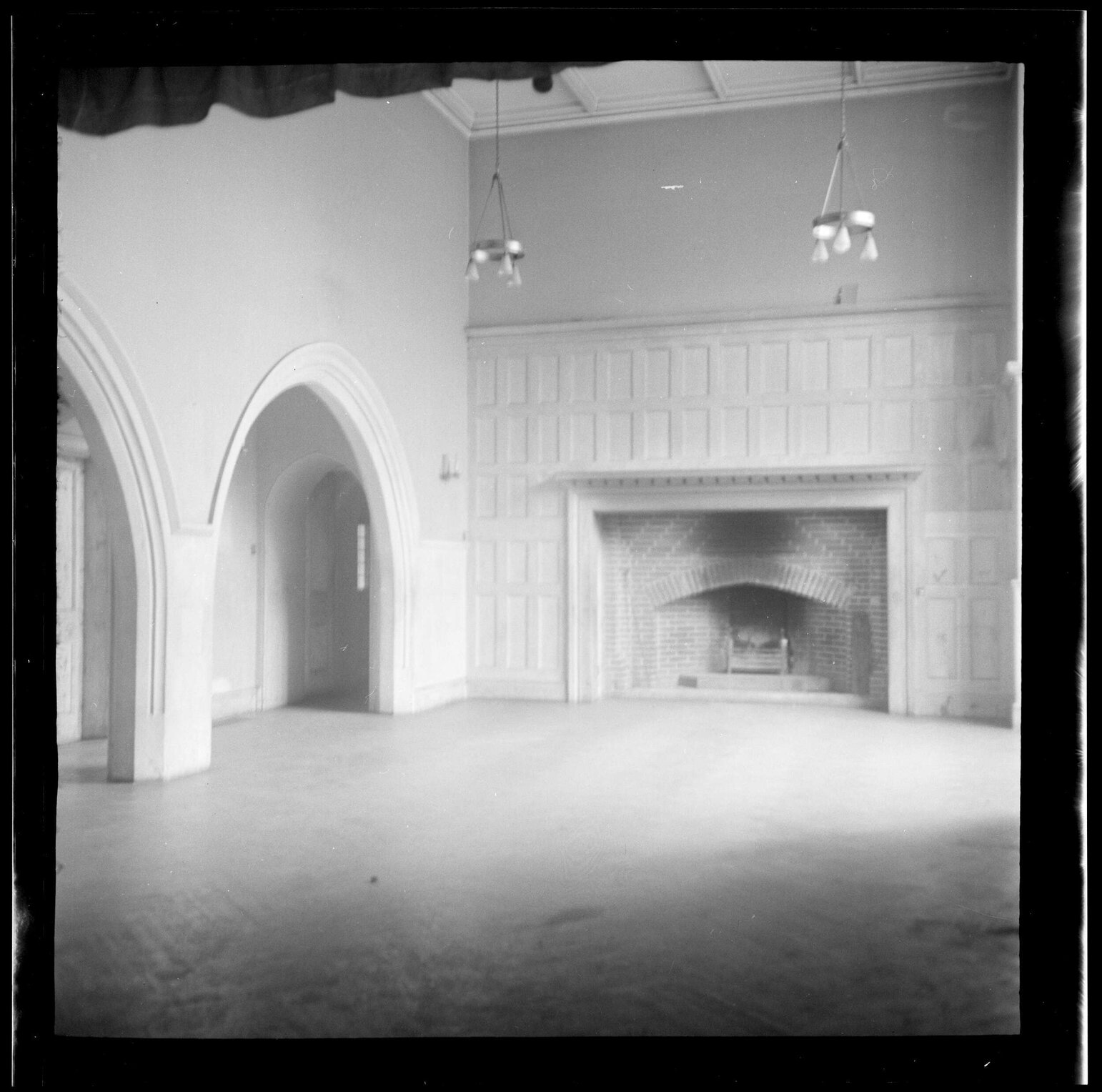 Interior with arches and large fireplace [at Abbey School]