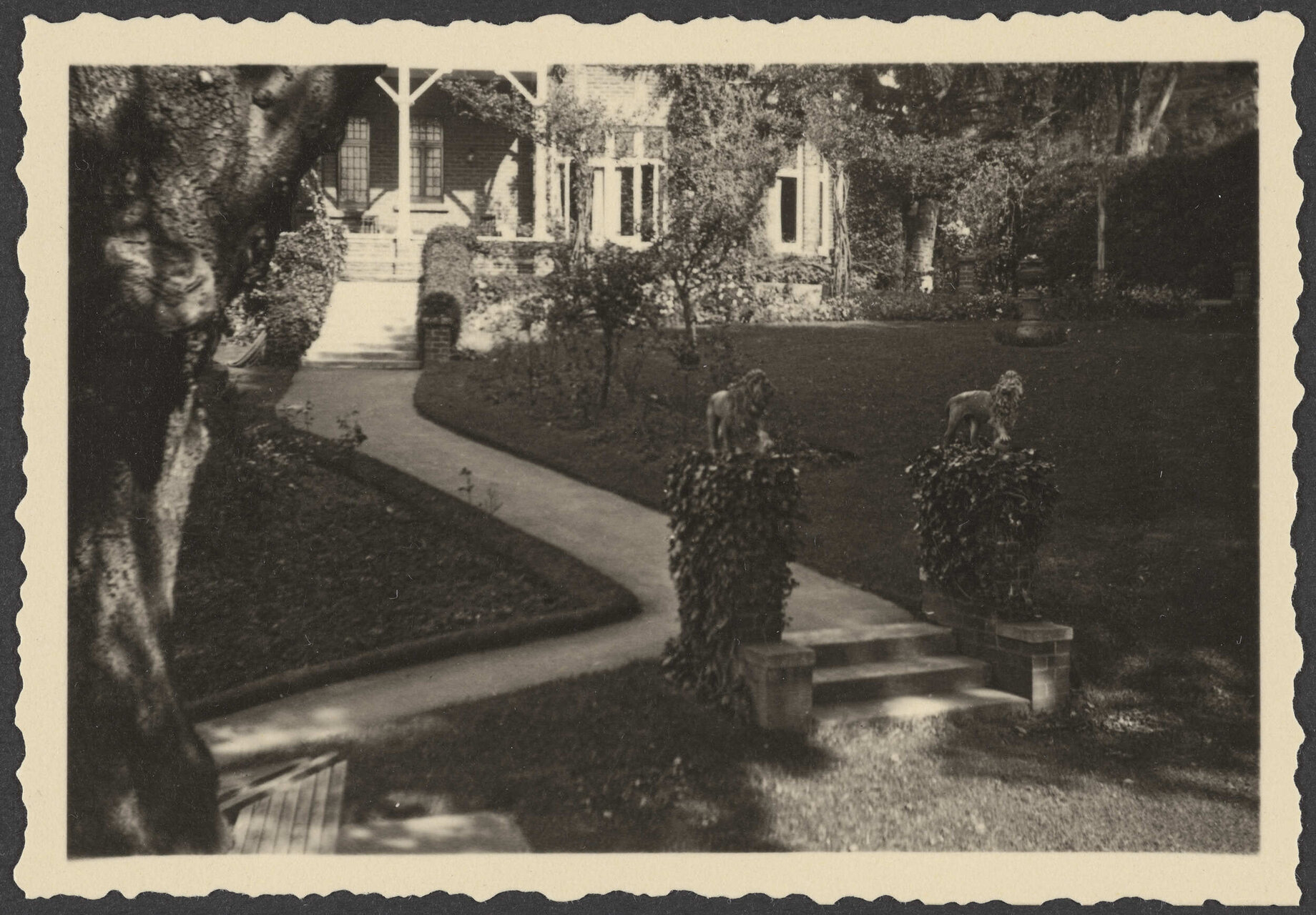 Manono from garden, showing path and lion statues