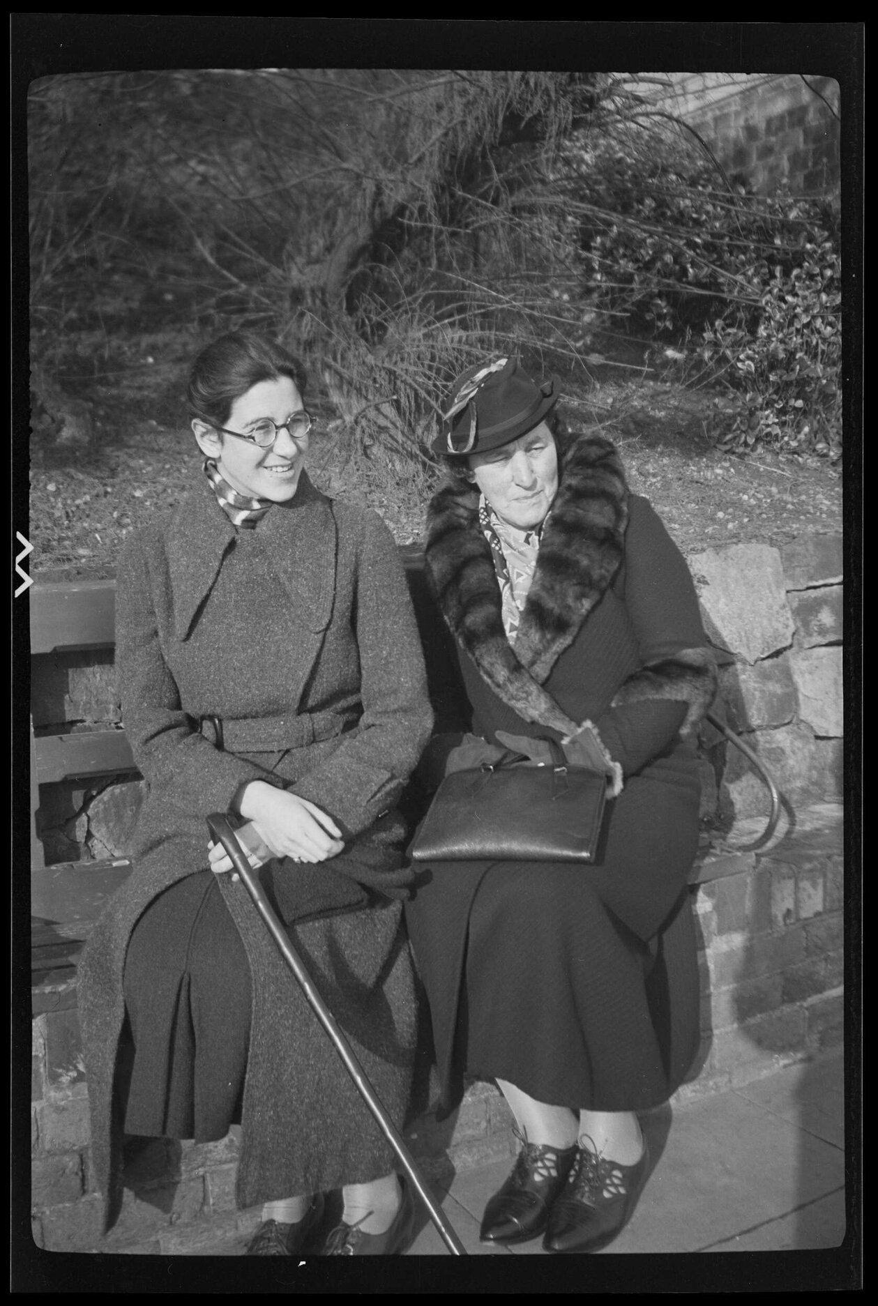 Lesley Brasch and an unidentified older woman sitting on a bench