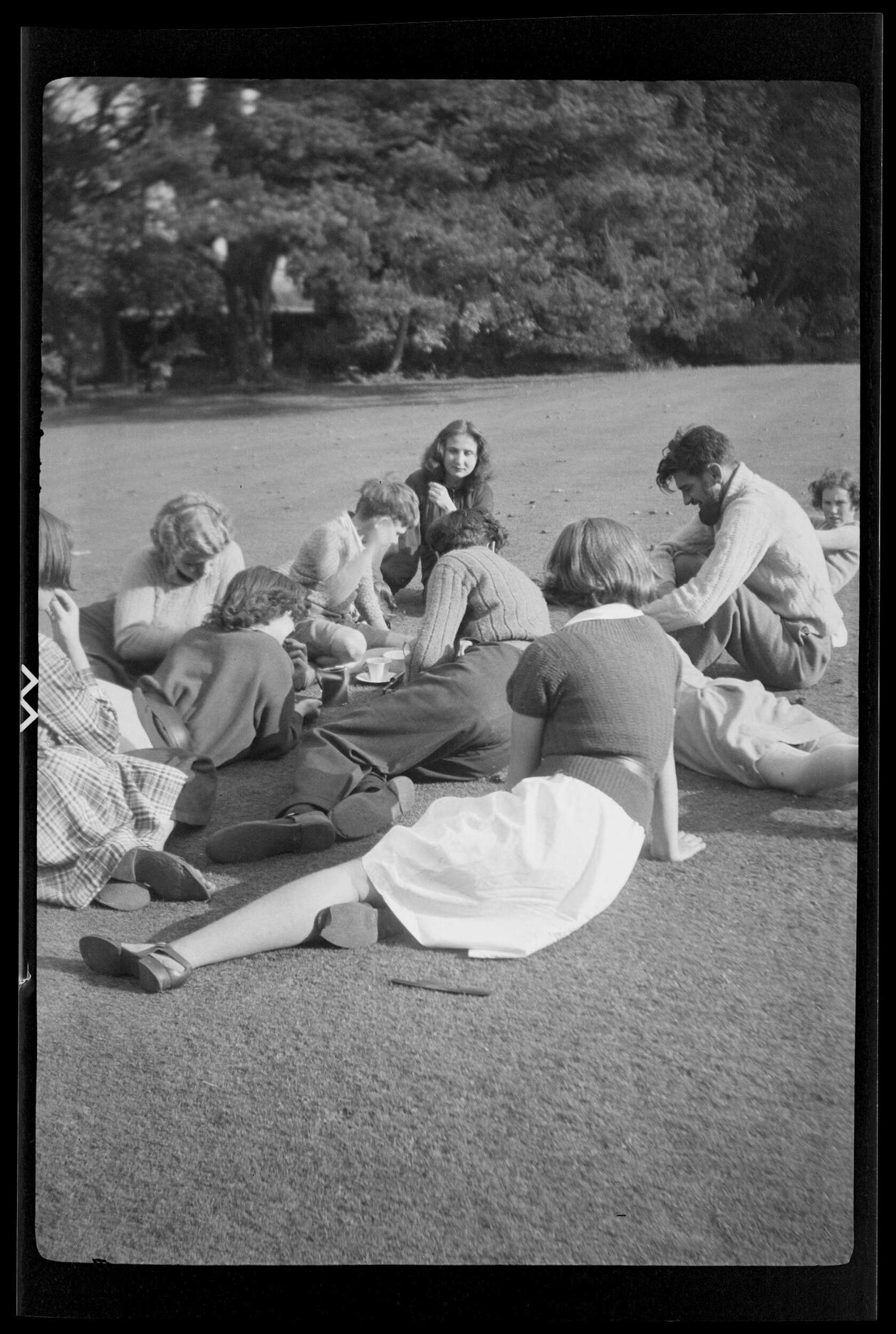Group of people on lawn [at Abbey School]