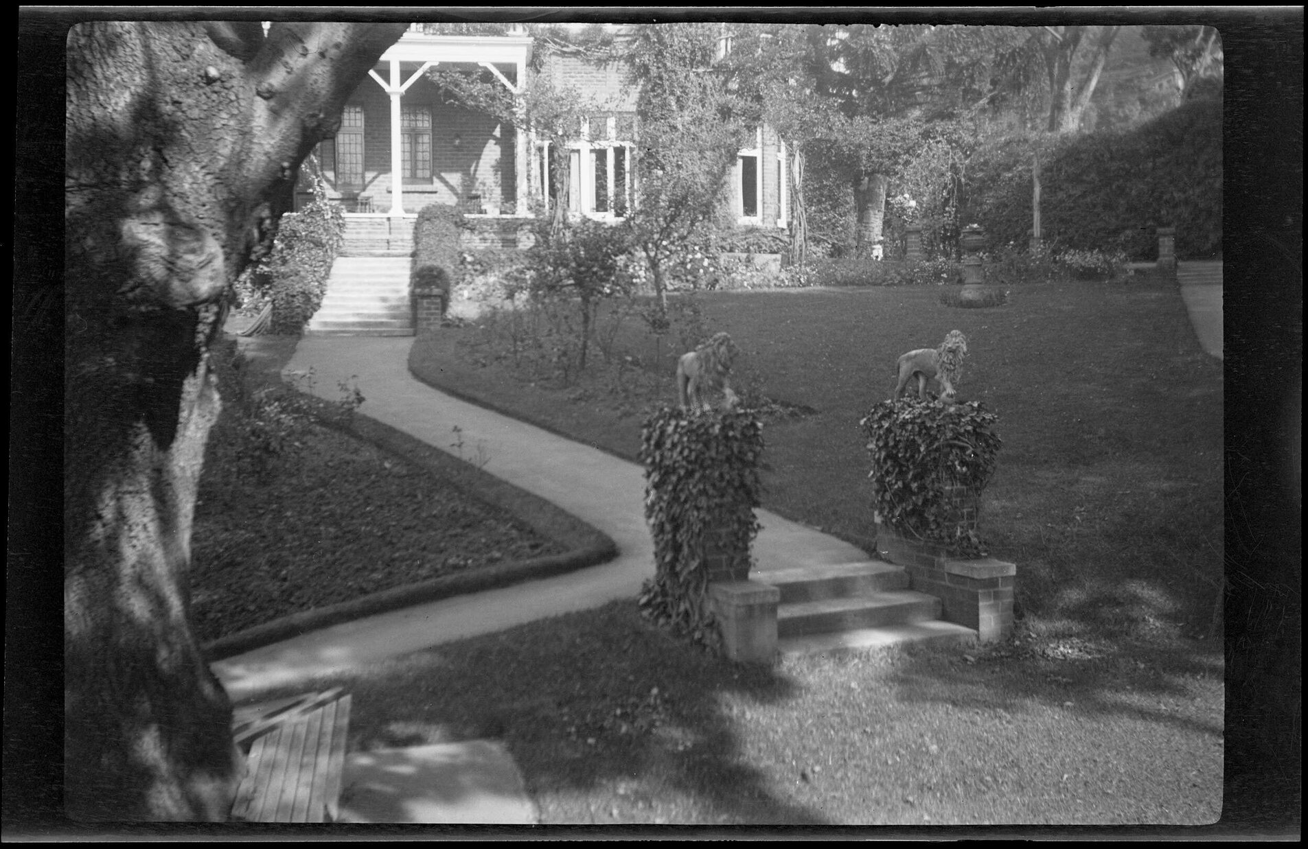 Manono from garden, showing path and lion statues