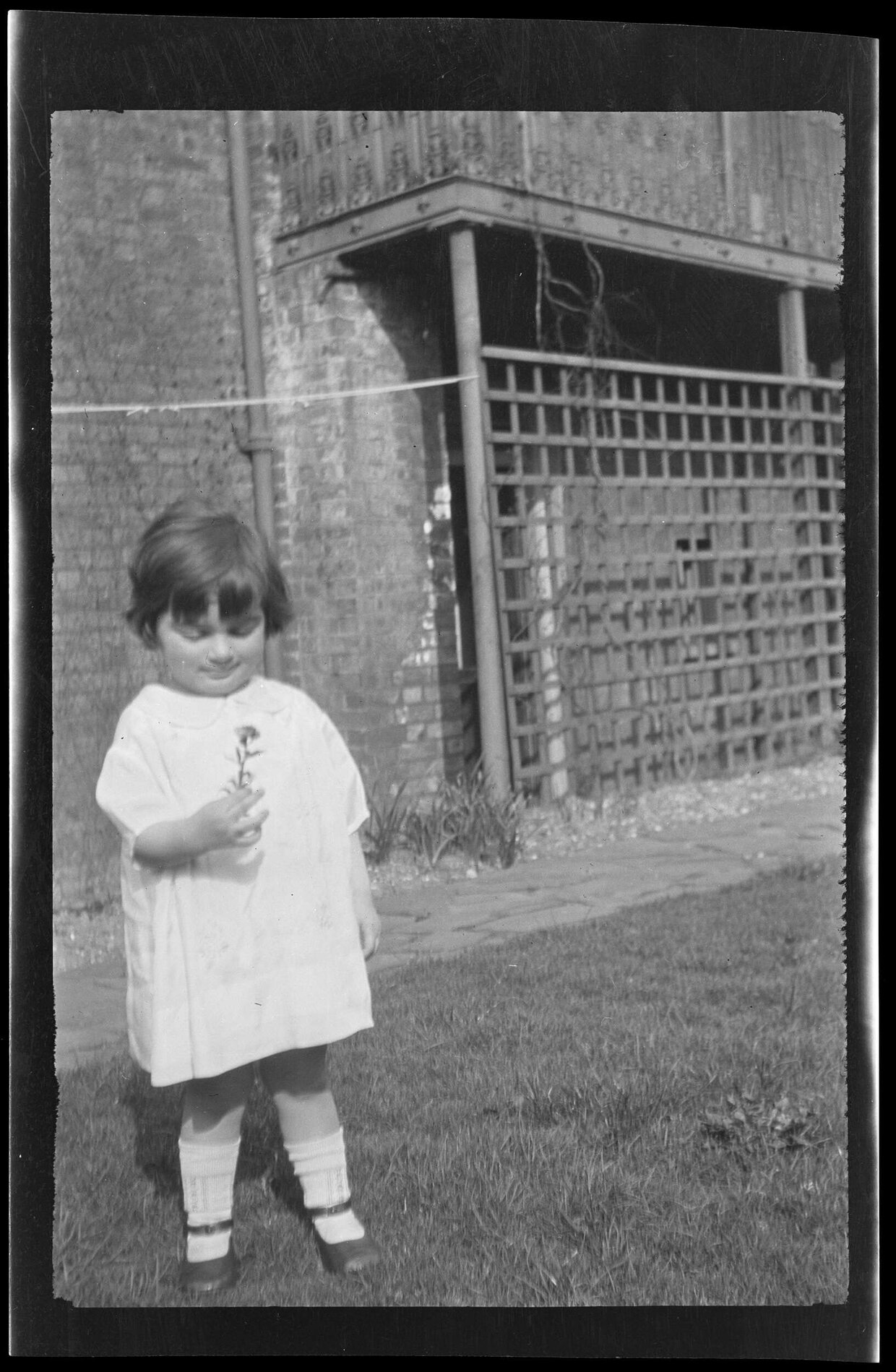 Young girl holding a flower