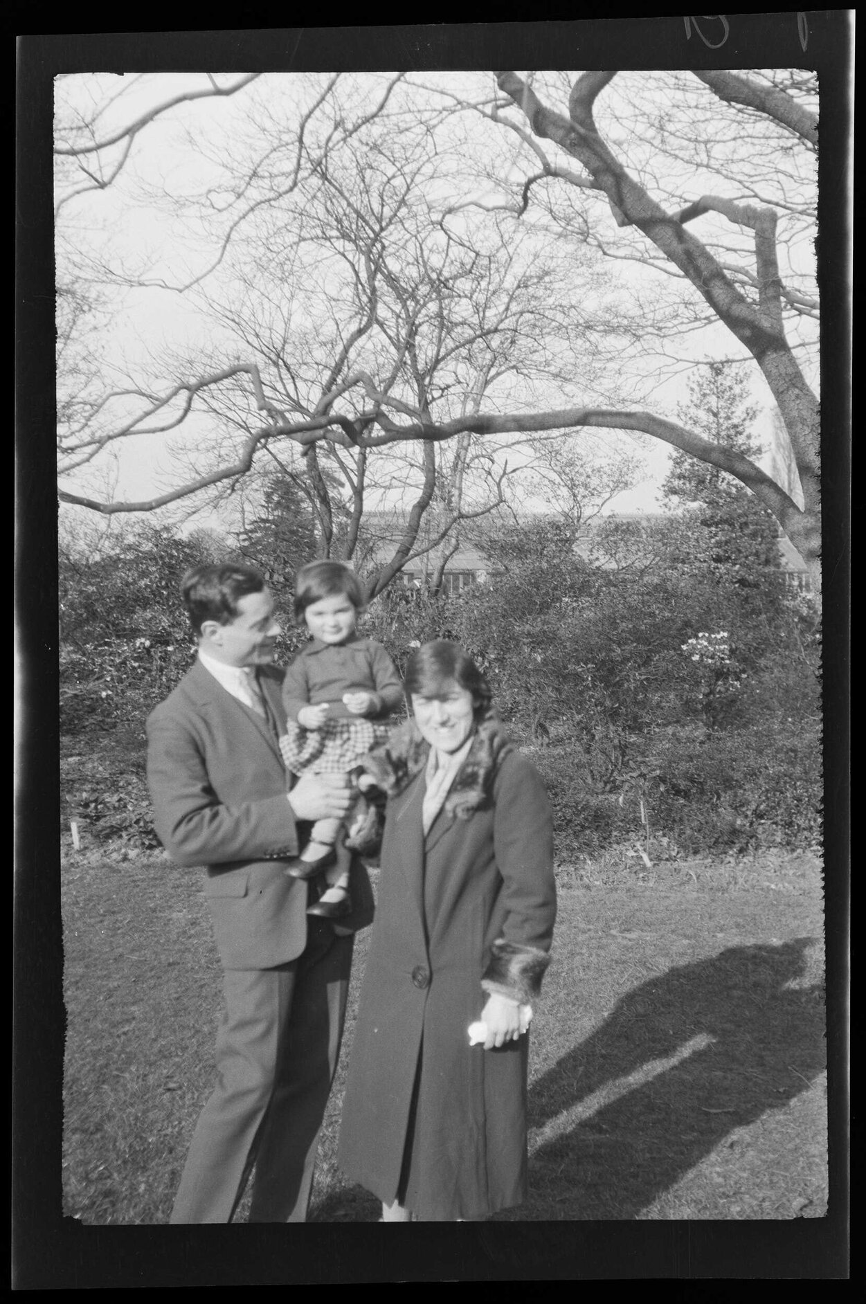Man and woman holding a young girl